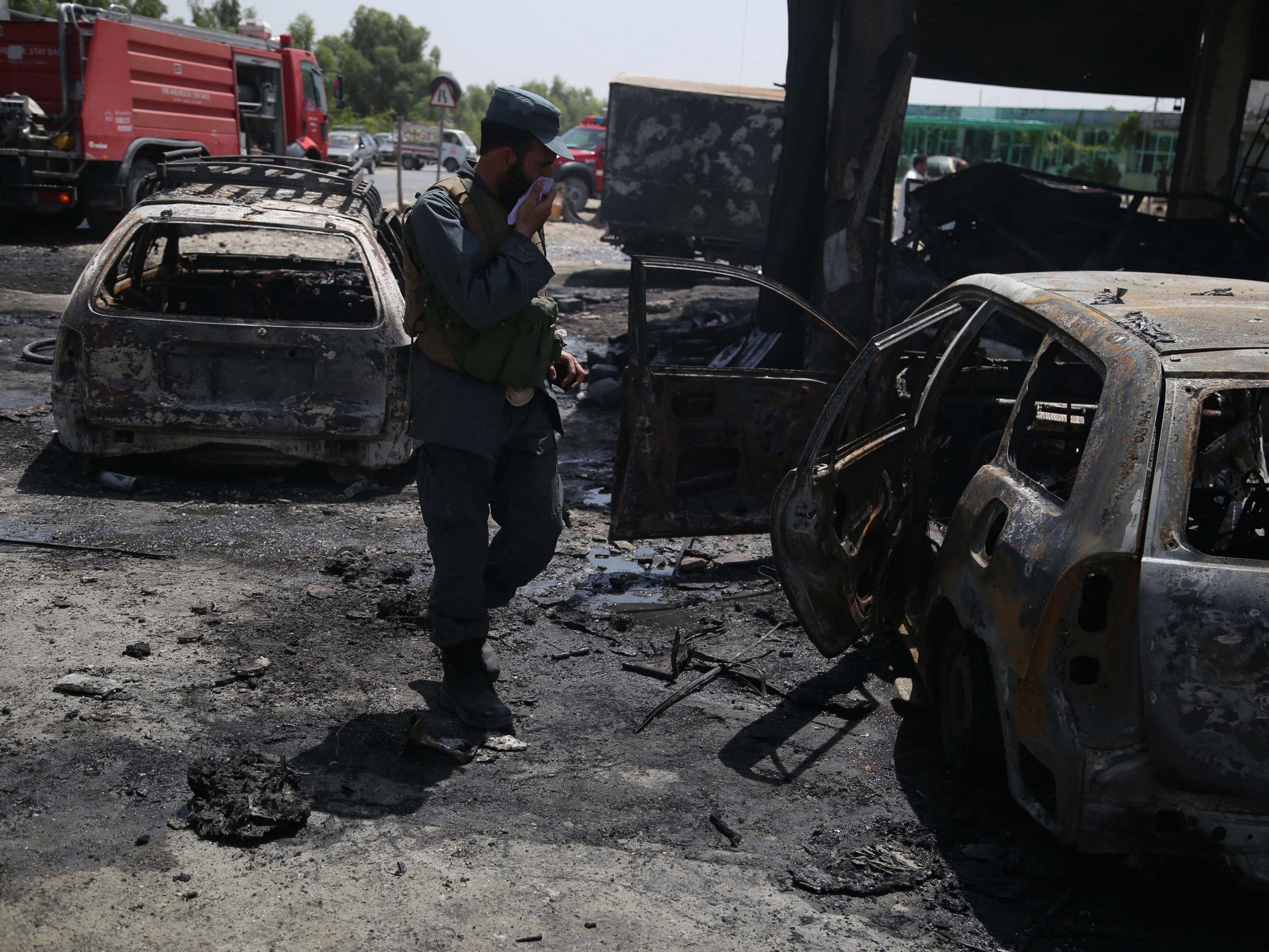 Officials inspect the site of the attack