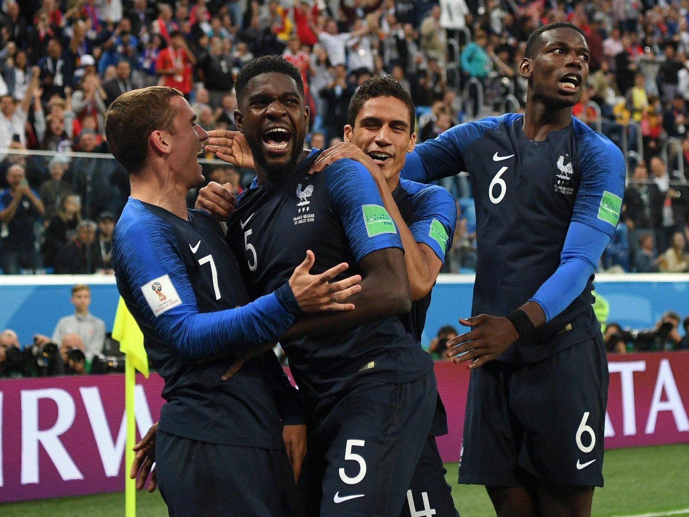 Samuel Umtiti celebrates with teammates after scoring