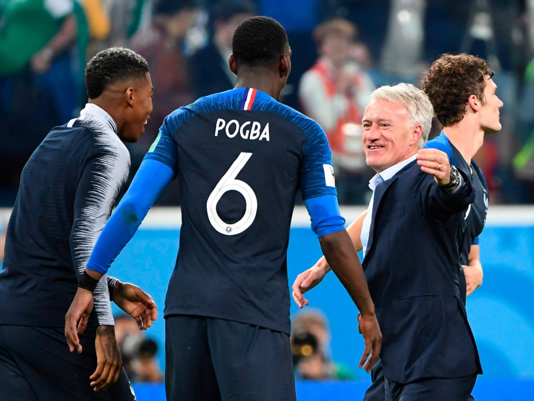 Didier Deschamps embraces Paul Pogba after the semi-final