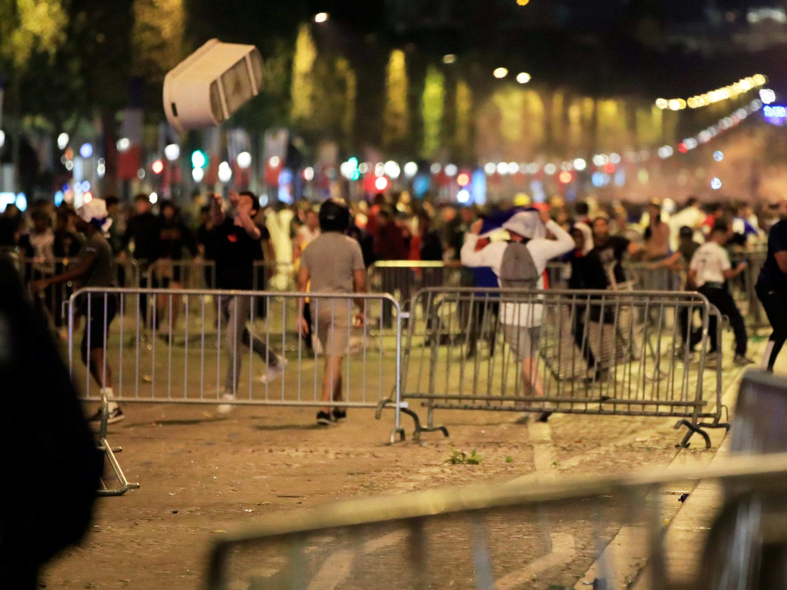 France fans clash on the Champs-Elysees after defeating Belgium in their World Cup semi-final match