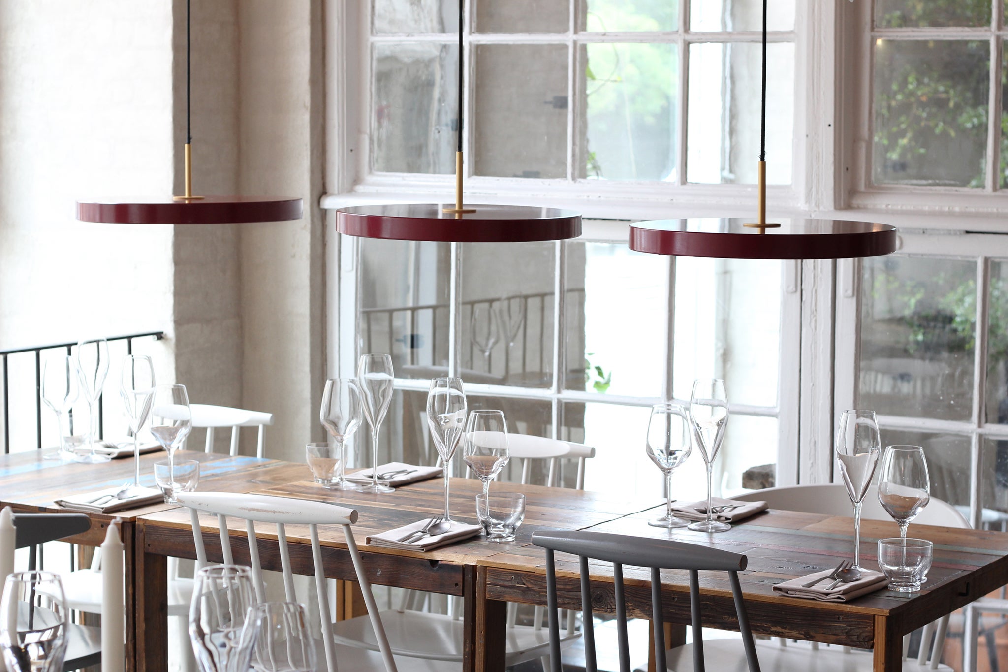 Ruby Red Asterias work well clustered over a dining table, from €199 (Vita Copenhagen)