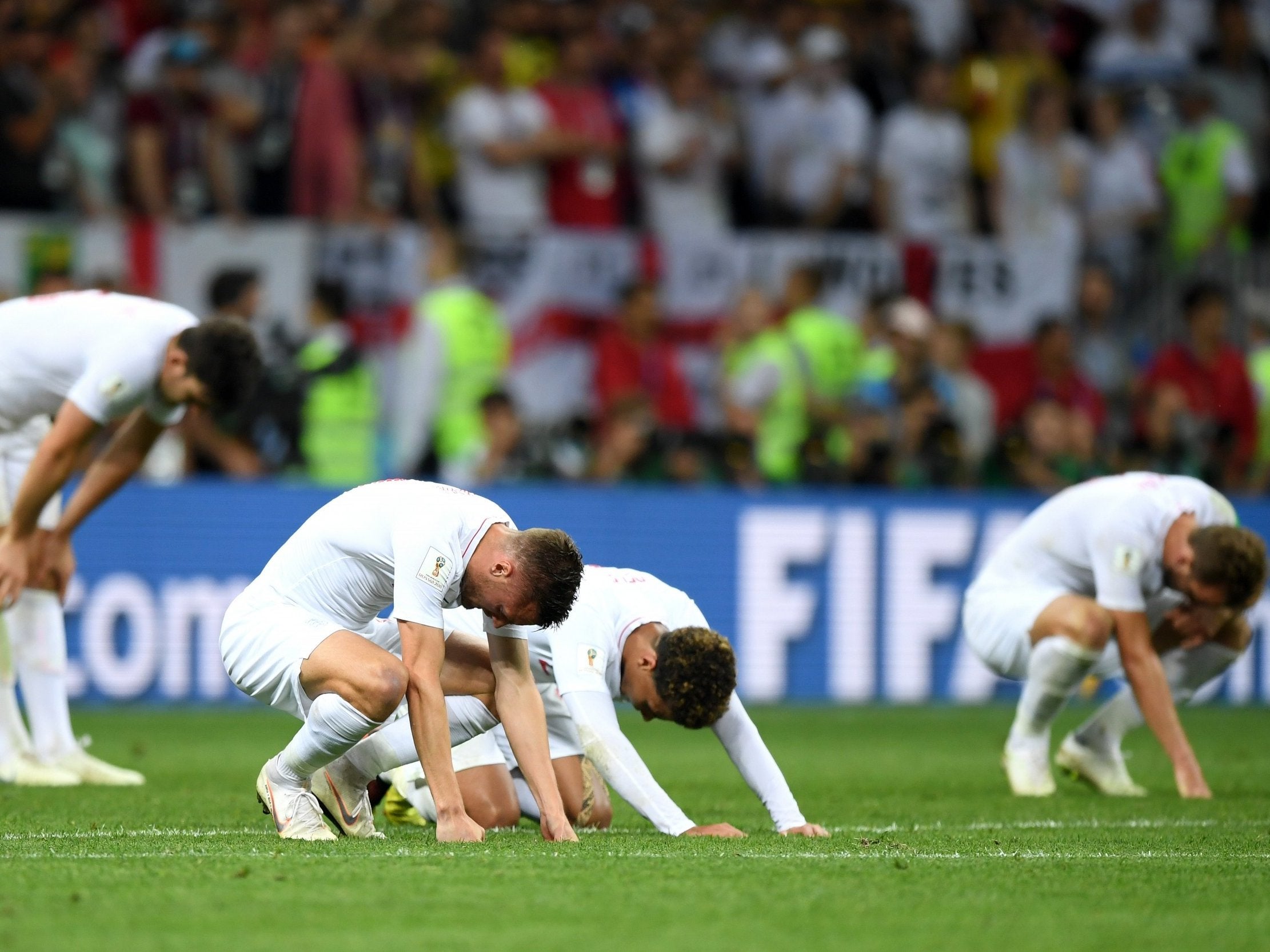 Jamie Vardy and Dele Alli of England look dejected following their side's defeat in the semi-final against Croatia