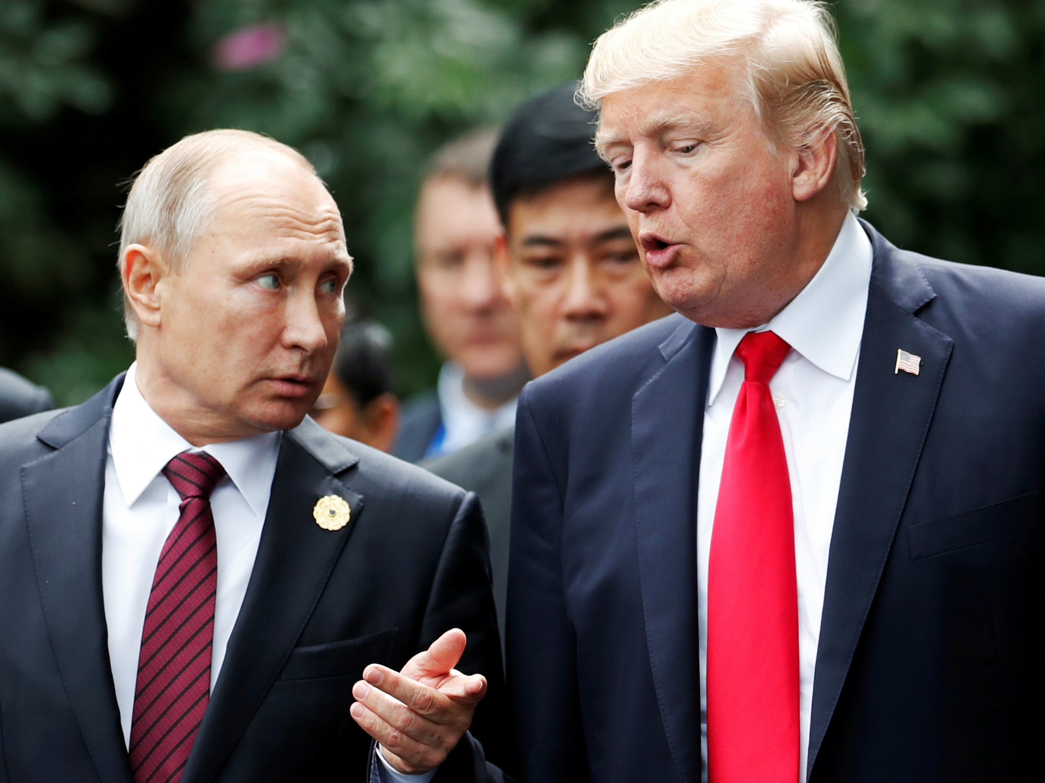 US President Donald Trump and Russia's President Vladimir Putin talk during the APEC Summit in Danang, Vietnam 11 November 2017. They are set to meet on 16 July in Helsinki, Finland.