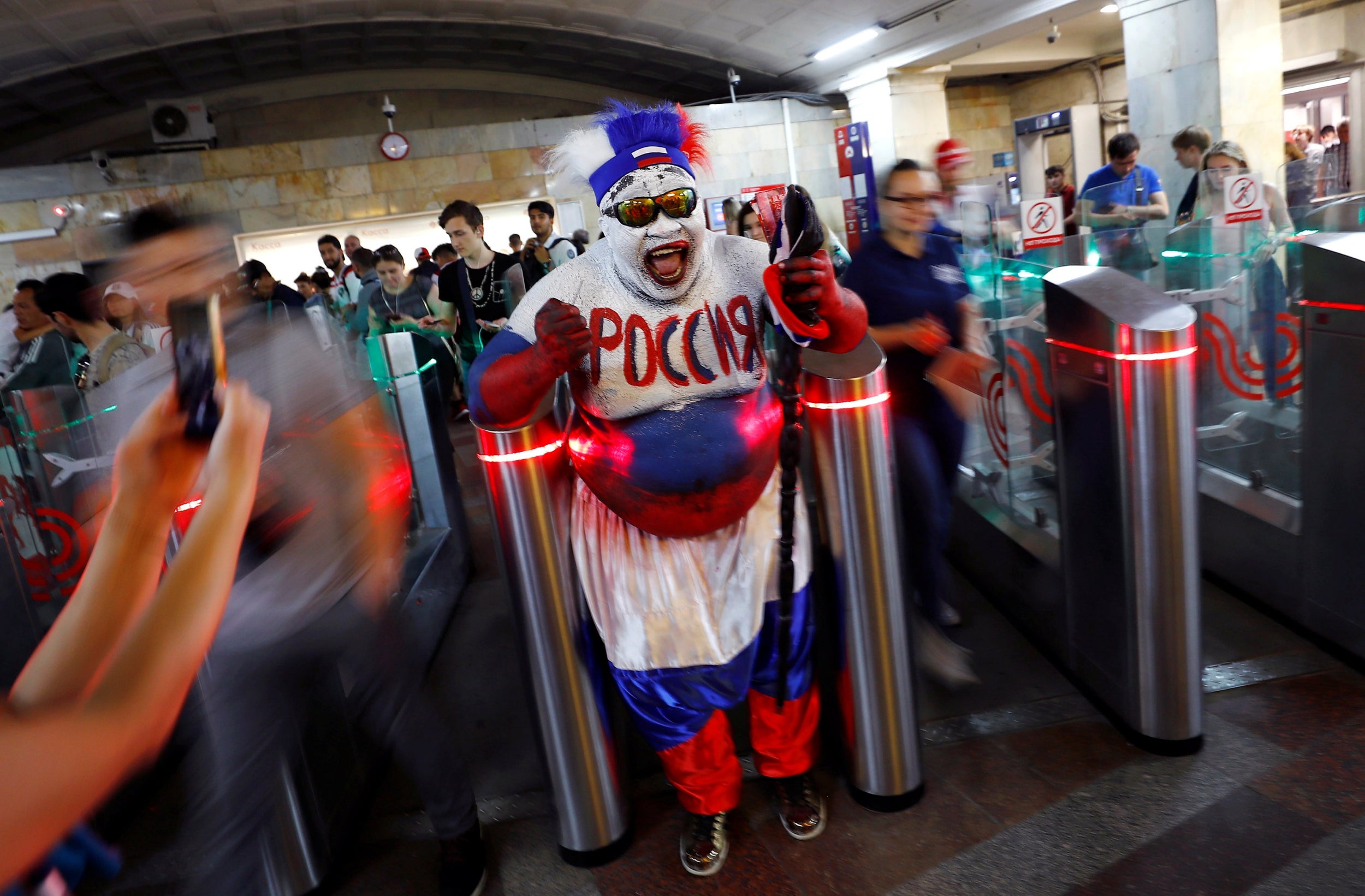 Zomo, a football fan from Cameroon walks into Okhotny Ryad metro station in Moscow