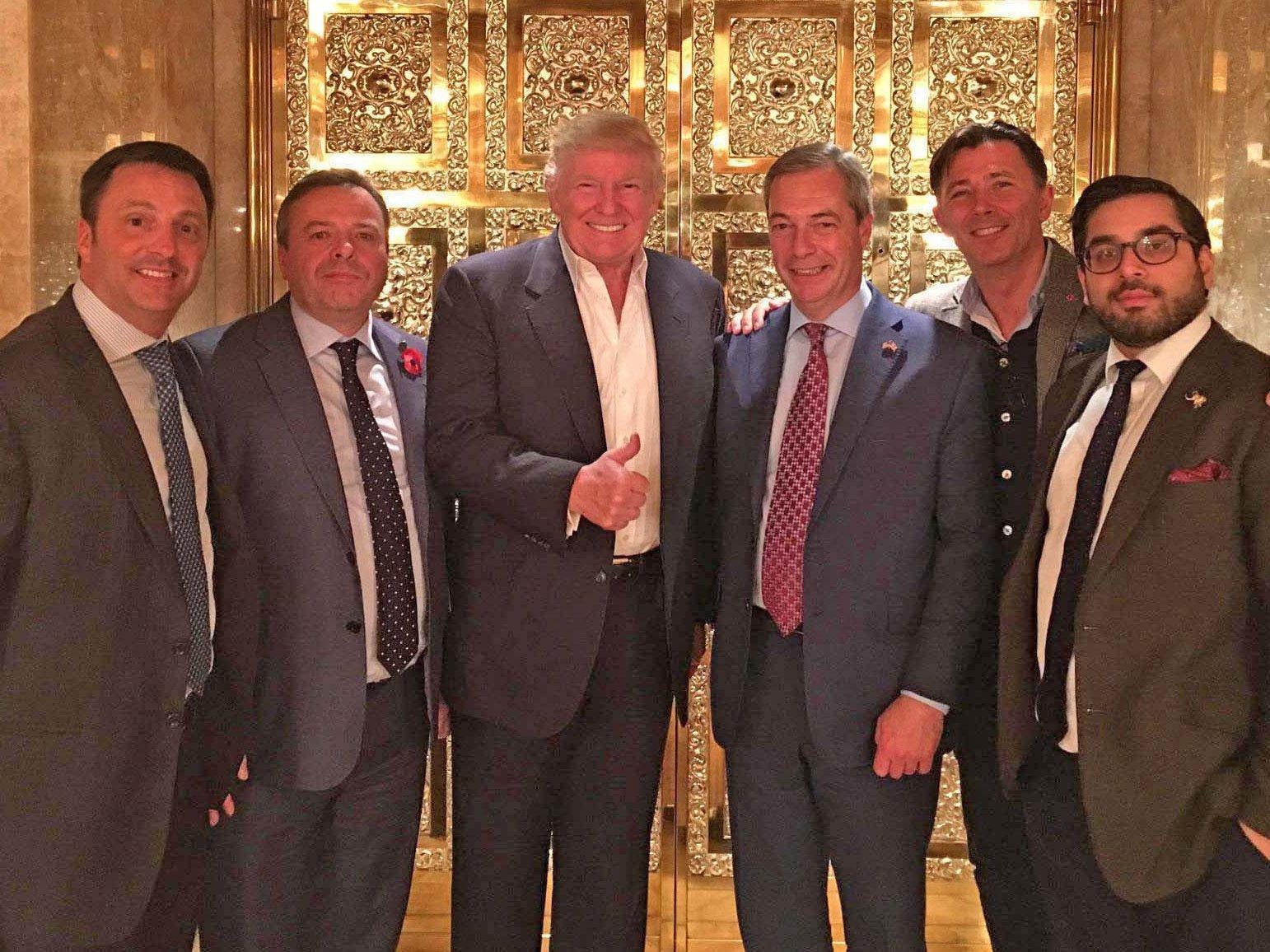 Nigel Farage (fourth) and Raheem Kassam (right) are notable friends of the president (Tim Stewart News Limited)