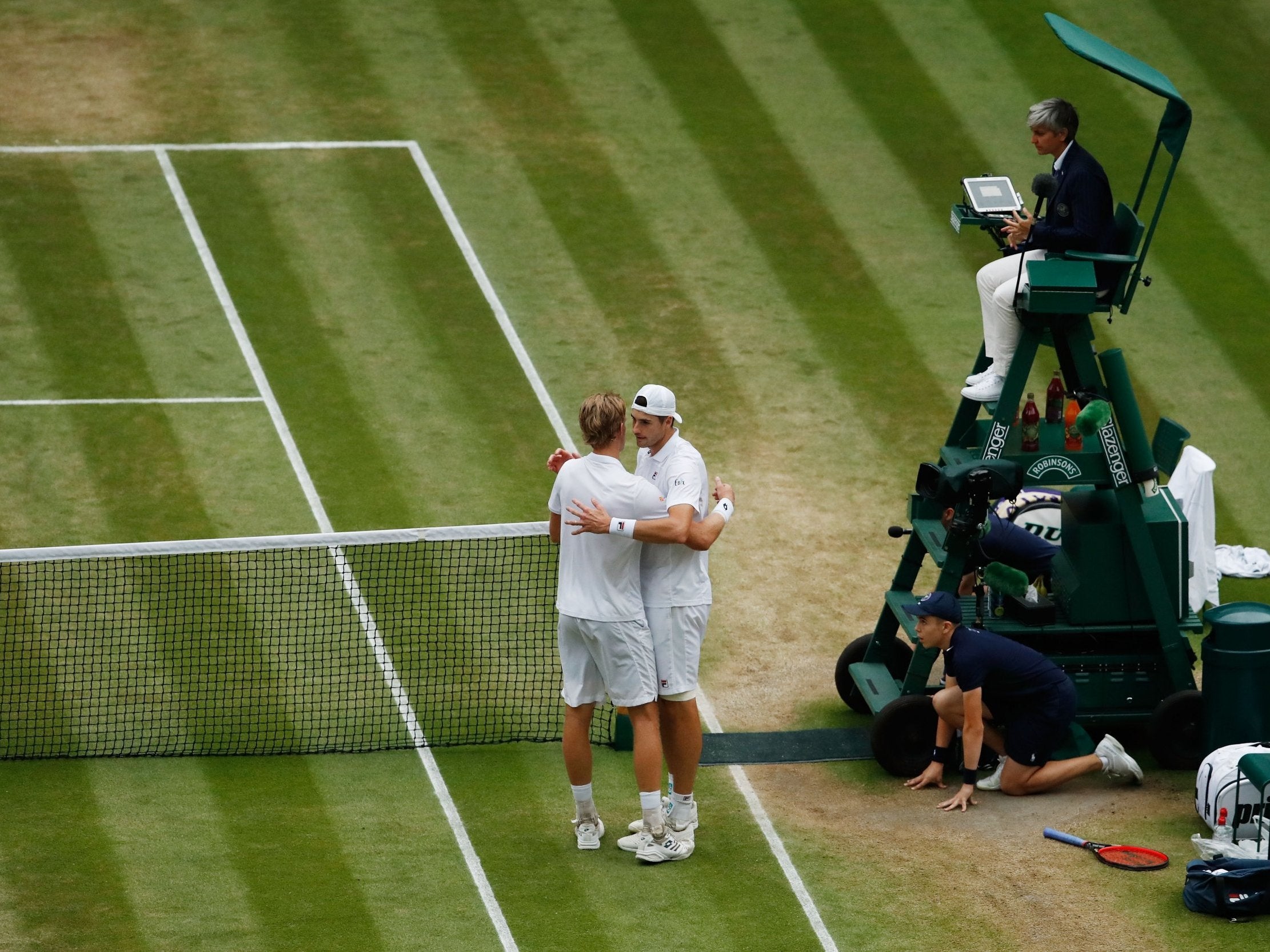 Kevin Anderson, left, and John Isner embrace after the match (Getty Images)