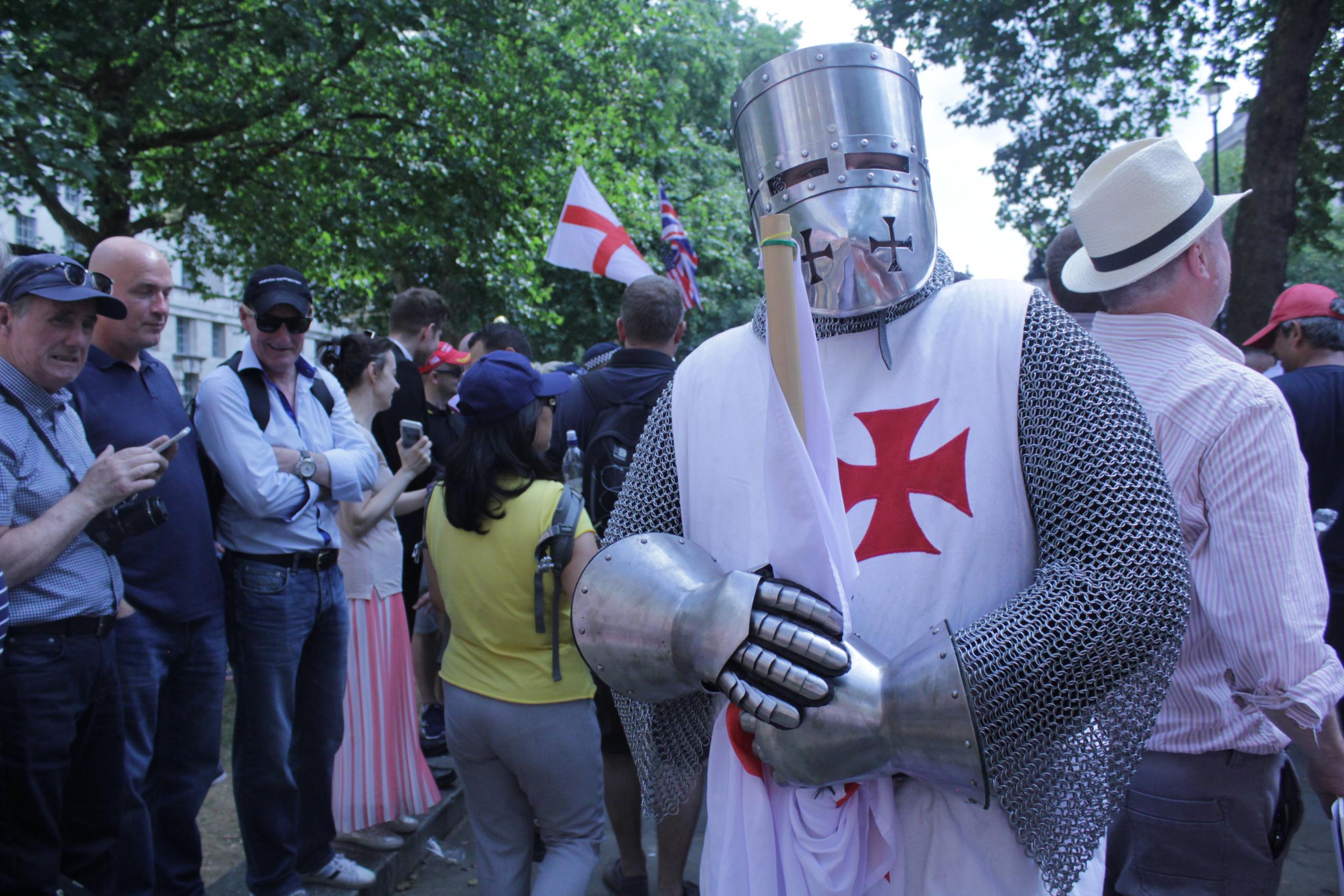 A protester dresses as a Crusader to keep Islam at bay