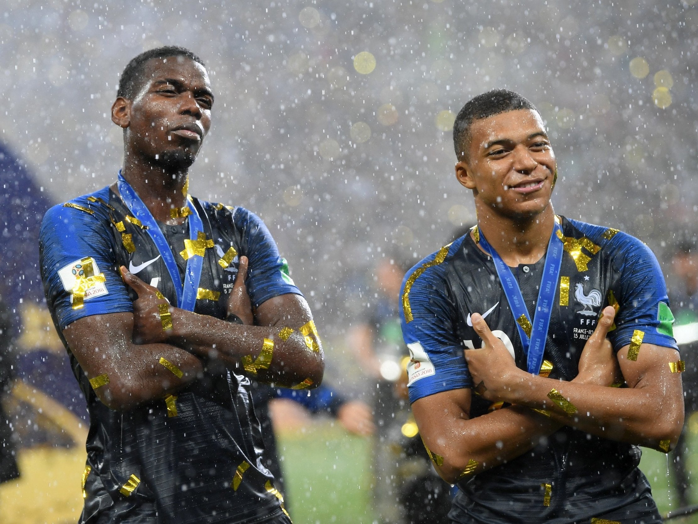 Paul Pogba and Kylian Mbappe of France celebrate victory