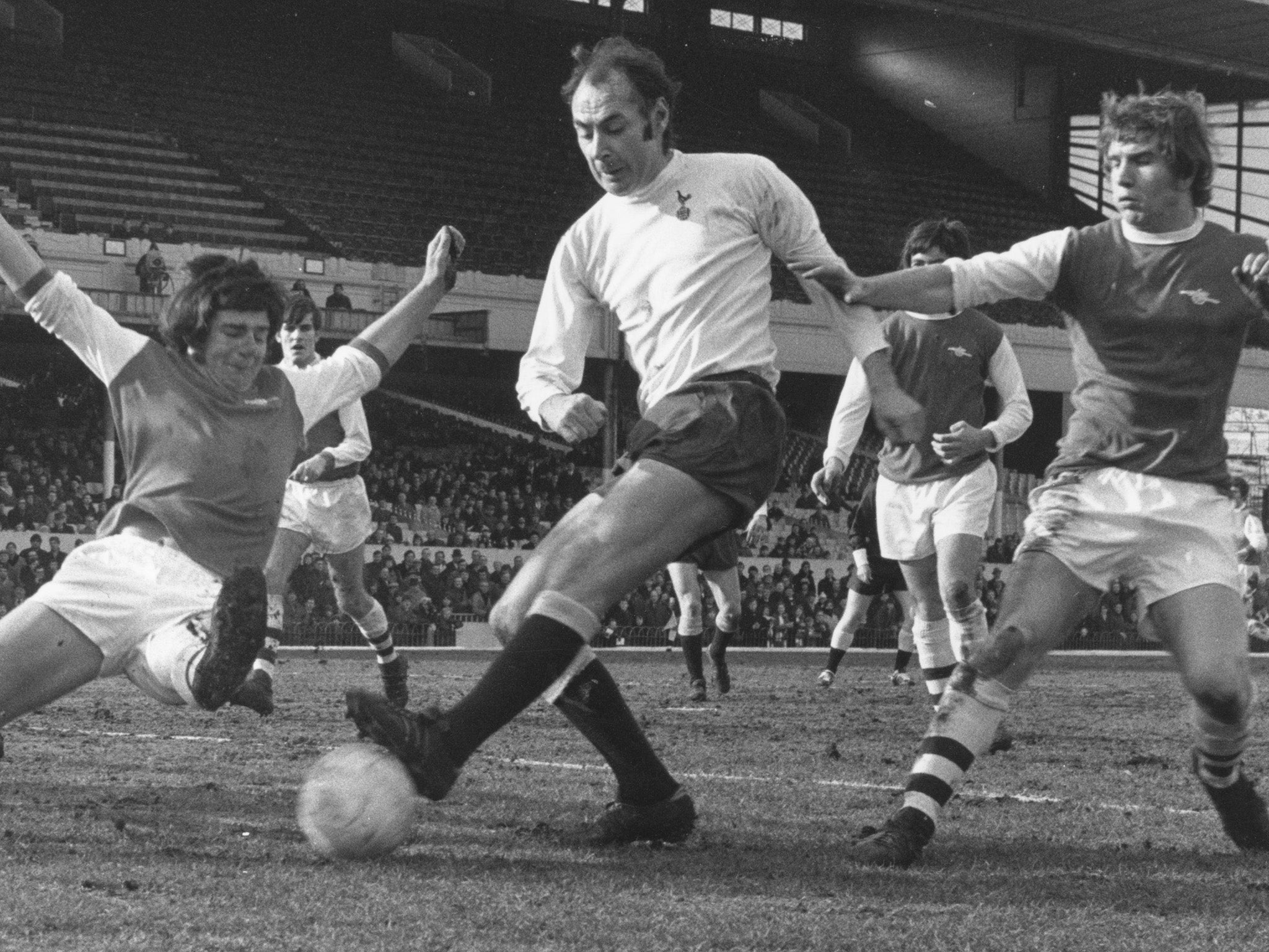 Tottenham Hotspur forward Alan Gilzean strikes against rivals Arsenal