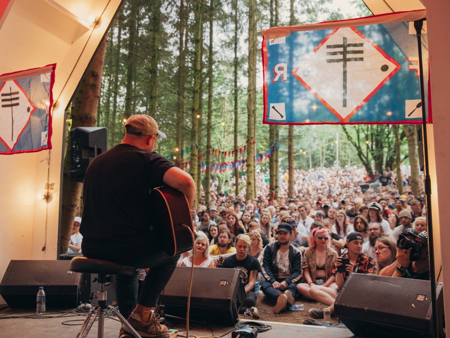 Andy Oliveri plays a Frightened Rabbit song at the Scott Hutchison tribute on the Forest stage