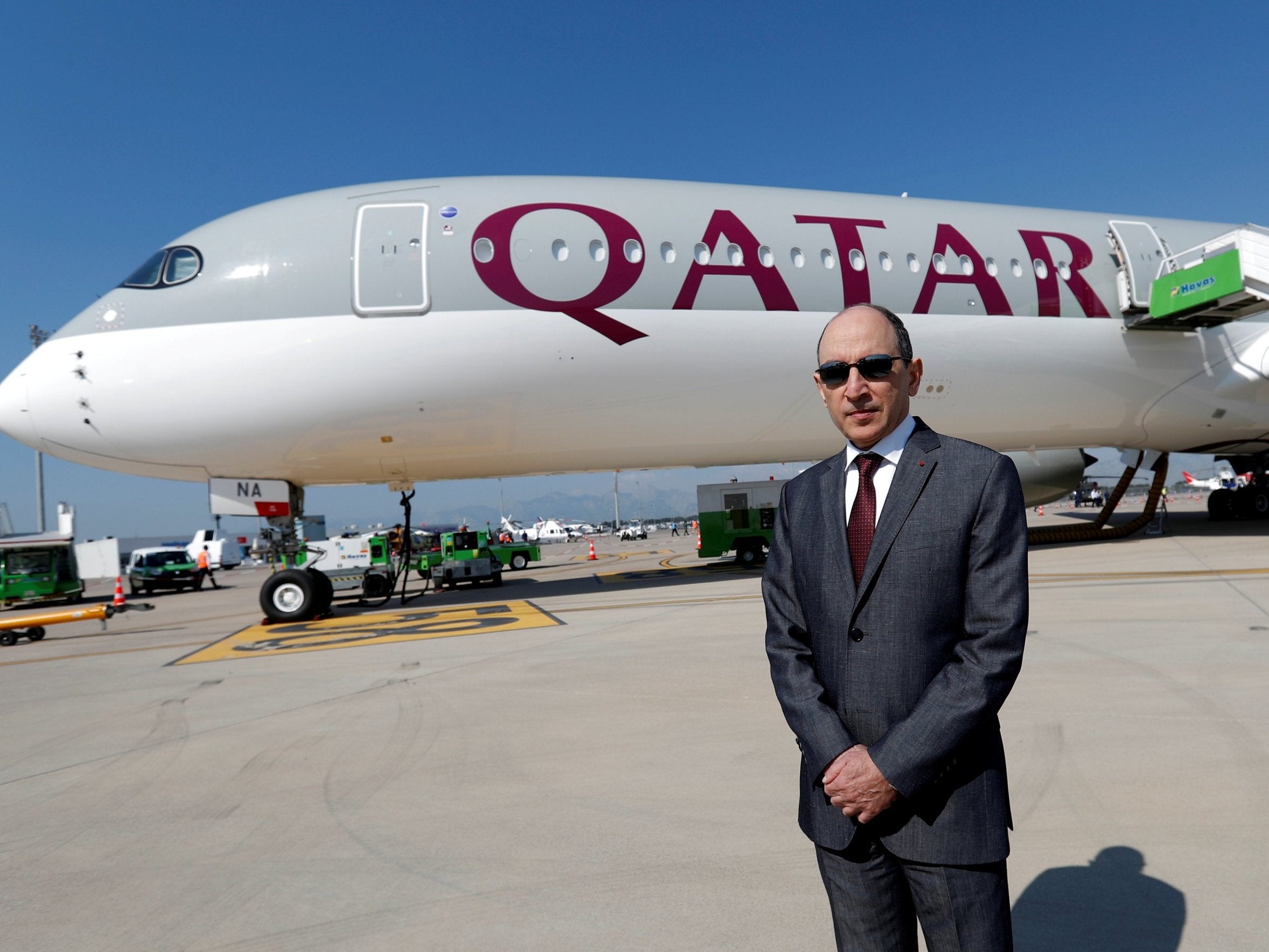 Qatar Airways Chief Executive Officer Akbar al-Baker poses in front of an Airbus A350-1000