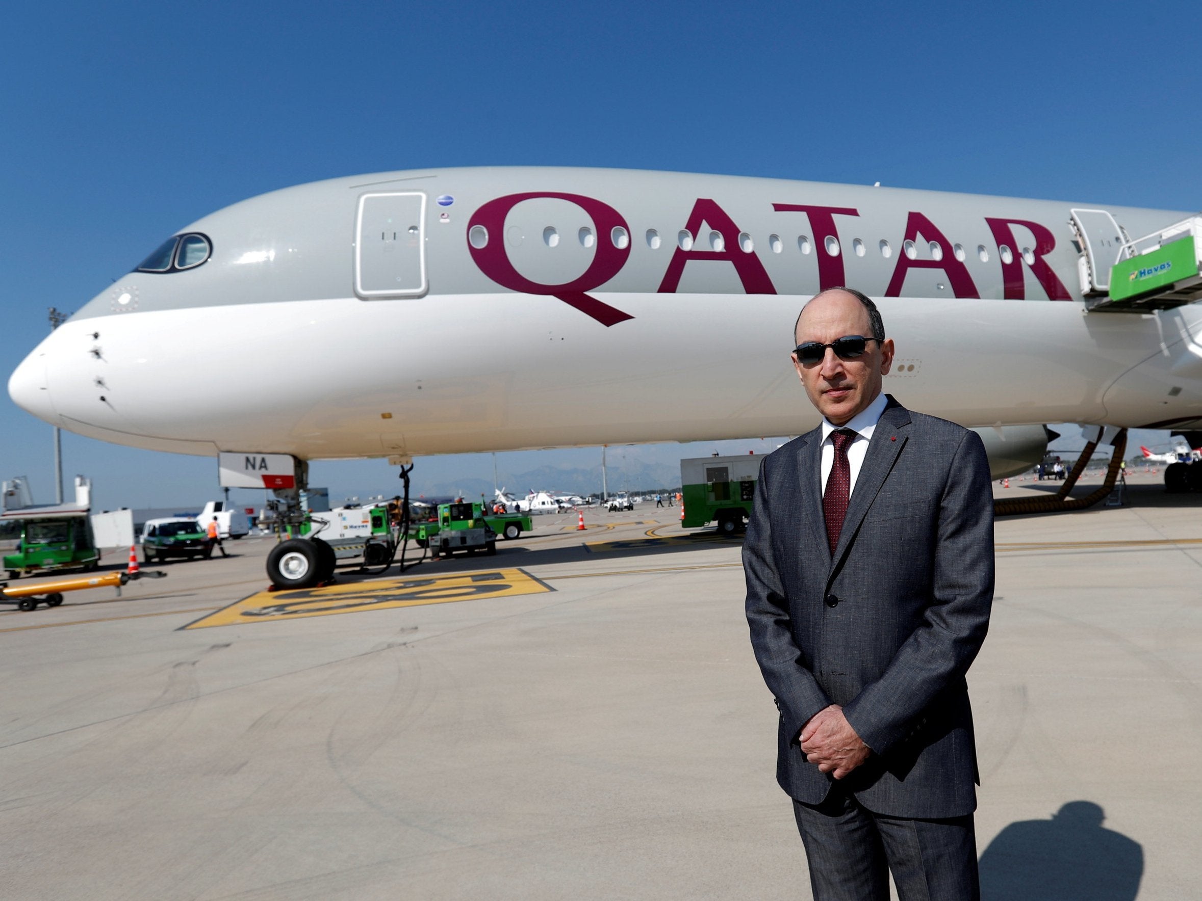 
Qatar Airways Chief Executive Officer Akbar al-Baker poses in front of an Airbus A350-1000 