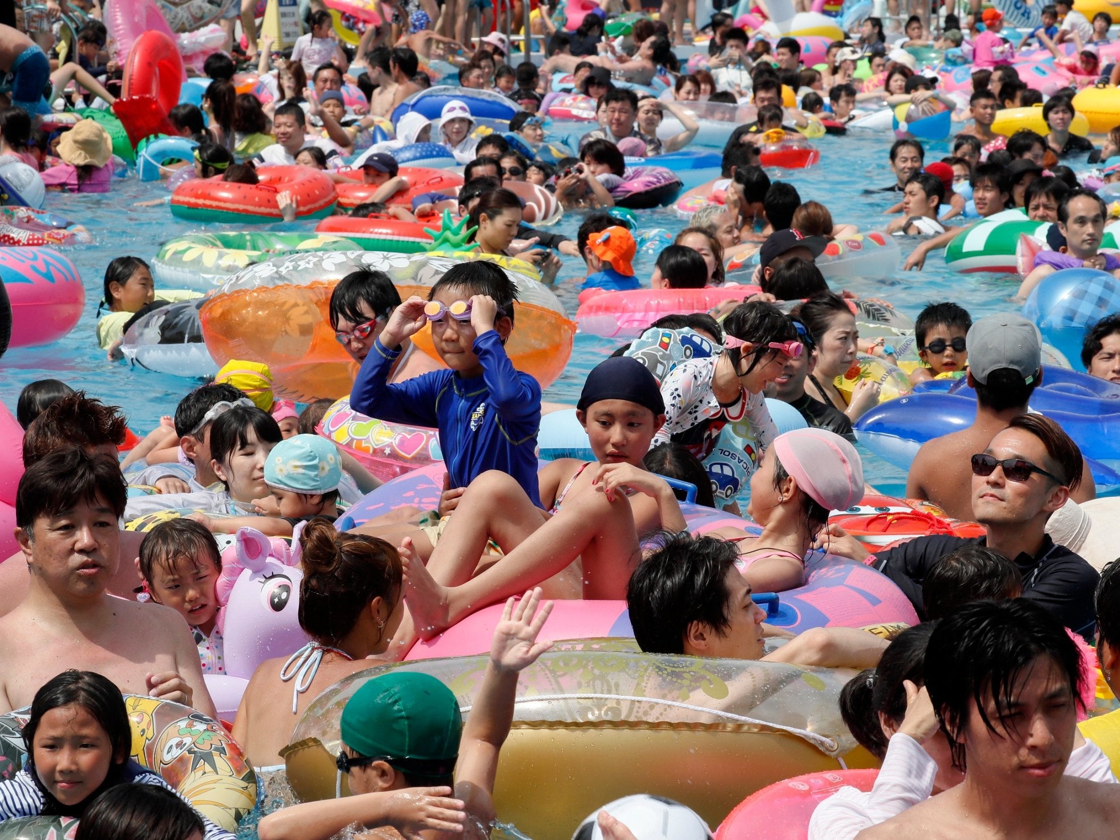 A pool in Tokyo's Toshimaen amusement park; the Japanese capital recorded a high of 36.3 C on 16 July