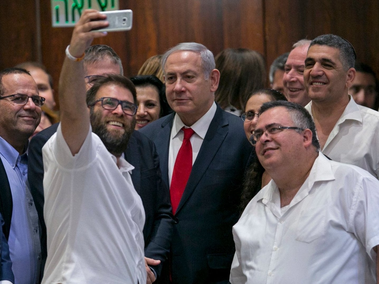 Knesset member Oren Hazan takes a selfie with Israel's Prime Minister Benjamin Netanyahu after the session