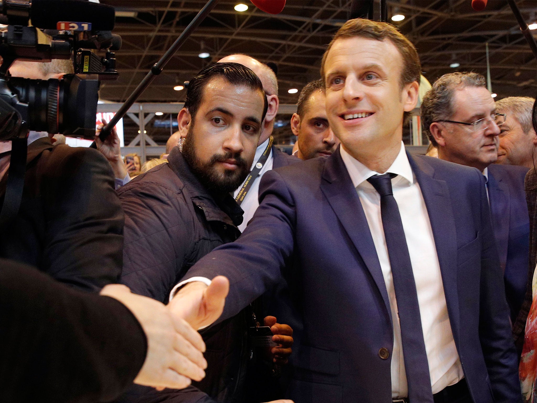 Then-French presidential candidate Emmanuel Macron pictured with bodyguard Alexandre Benalla in 2017