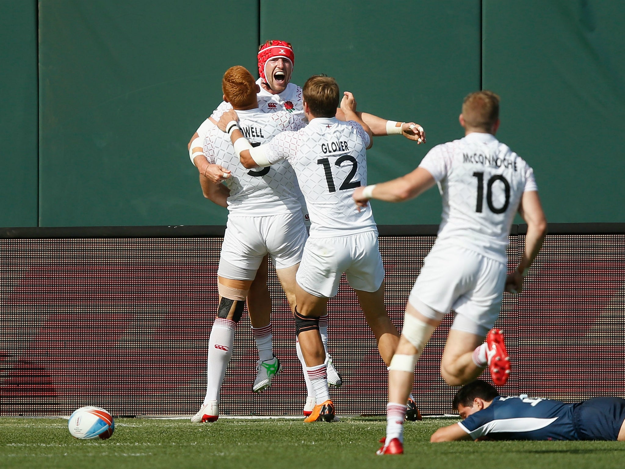 Phil Burgess celebrates after scoring a try to send England into the Sevens Rugby World Cup semi-finals