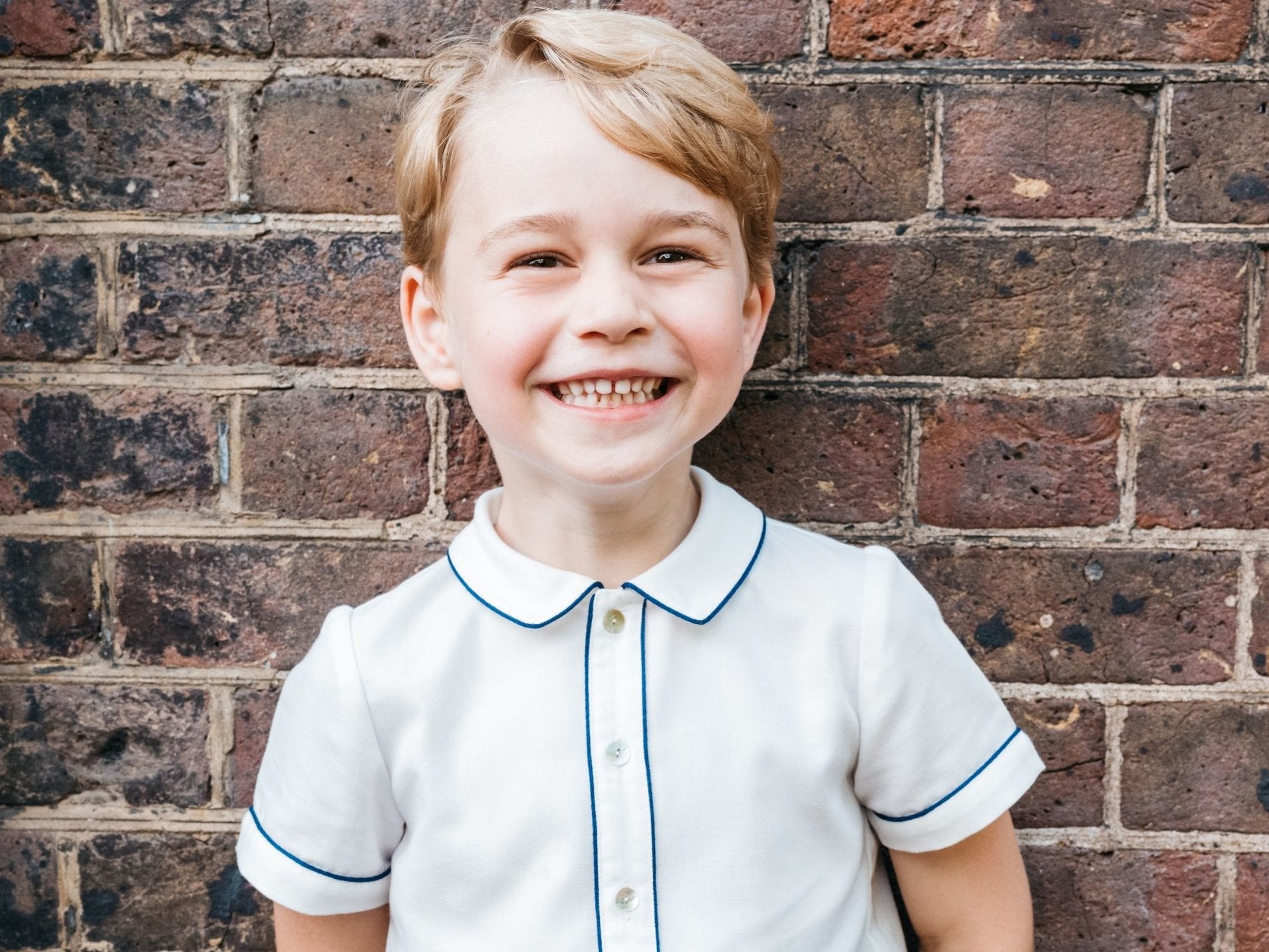 Prince George smiles in a picture released to mark his fifth birthday.