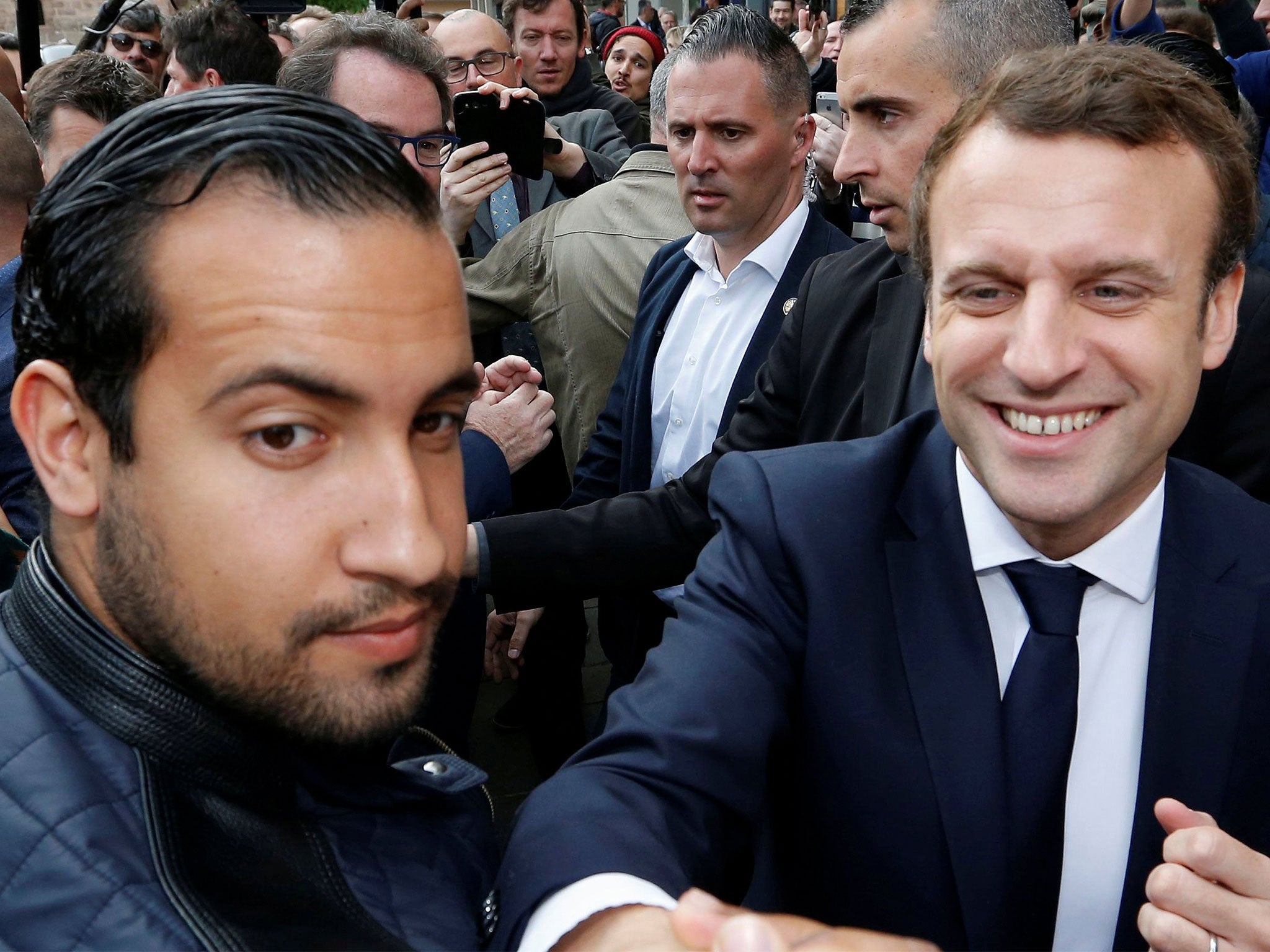 Alexandre Benalla, left, has been charged with a range of offences for beating up May Day demonstrators while pretending to be a riot police officer