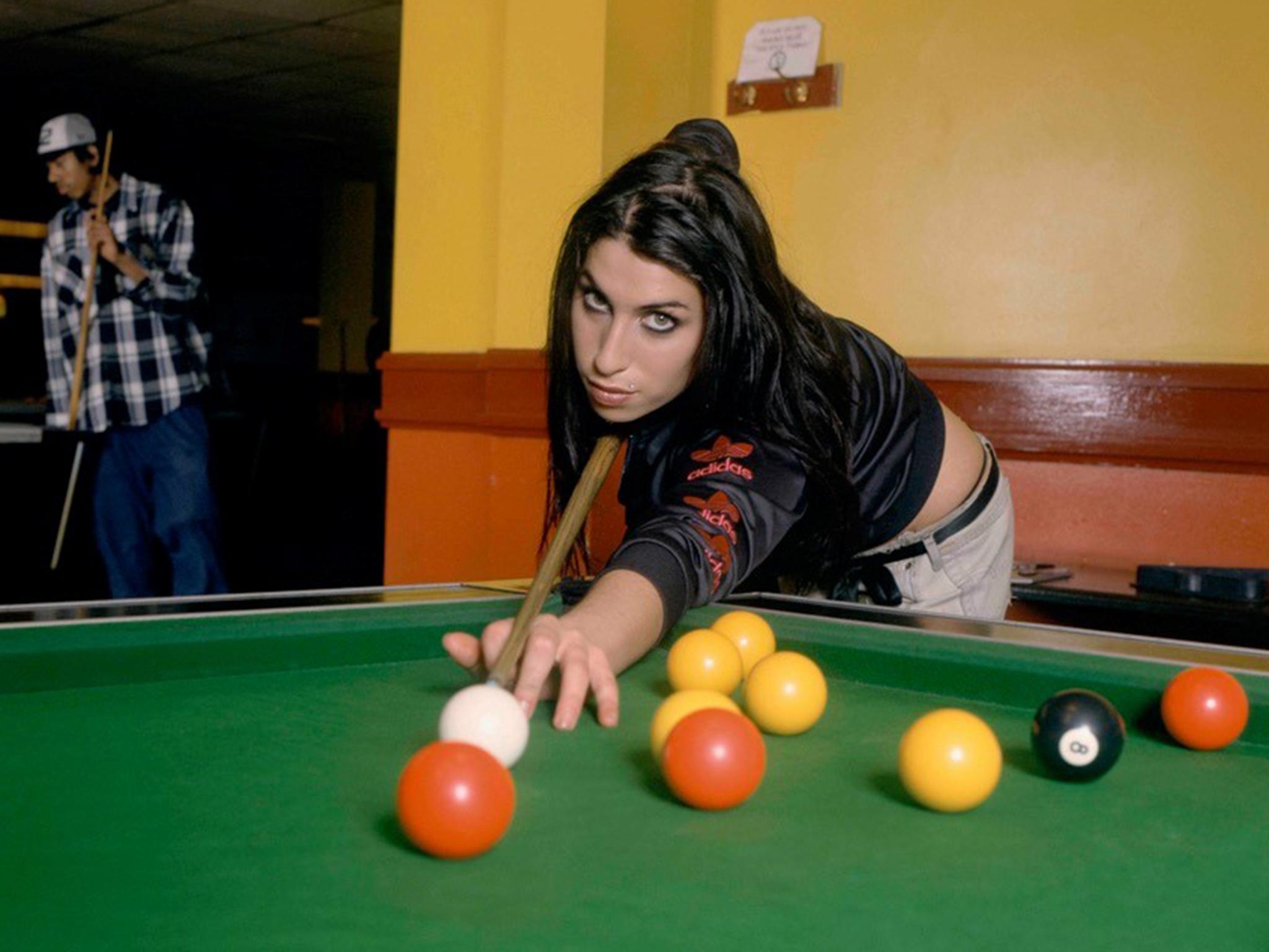 Losing game: the singer loved playing pool and the hall was used in the video for ‘Stronger Than Me’ (Diane Patrice/Whitebank Fine Art)