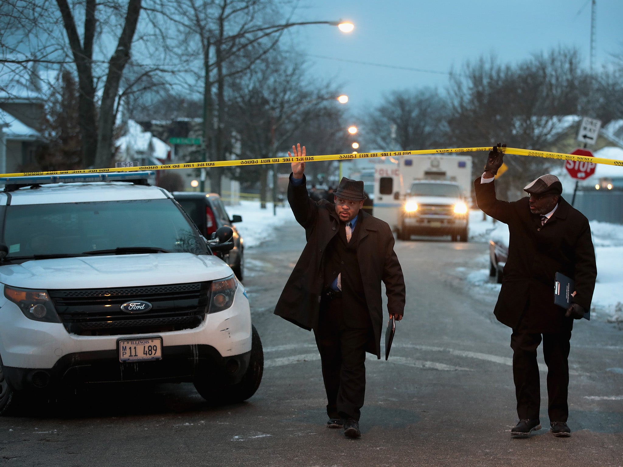 Chicago police investigate the scene of a quadruple homicide on the city's South Side. Chicago had more than 750 homicides in 2016