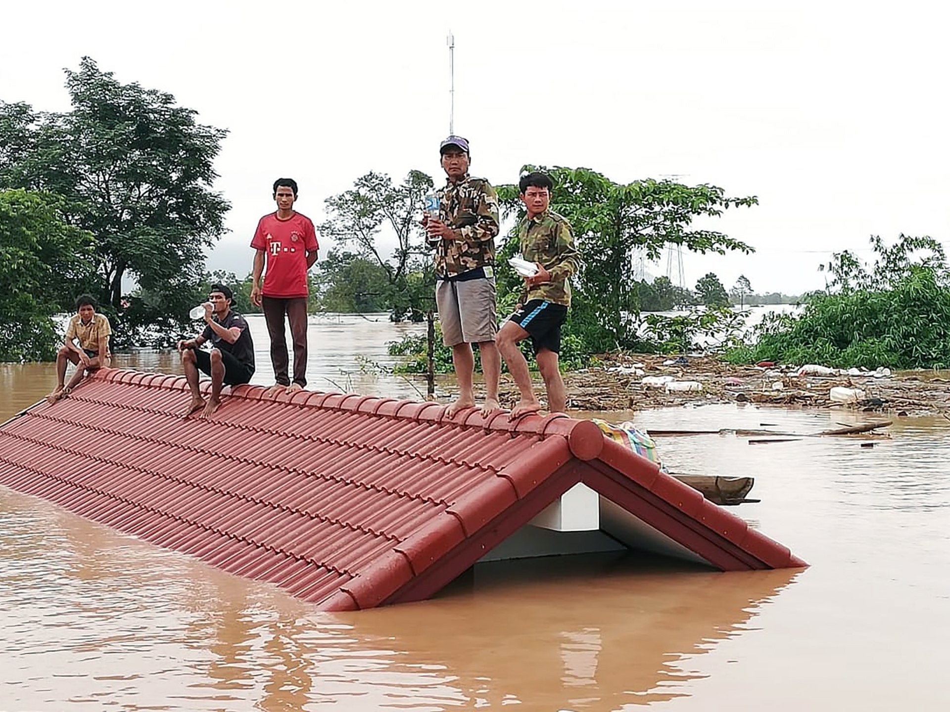 Villagers were stranded on roofs after evacuating their homes after the Xepian-Xe Nam Noy dam collapsed in a village near Attapeu province