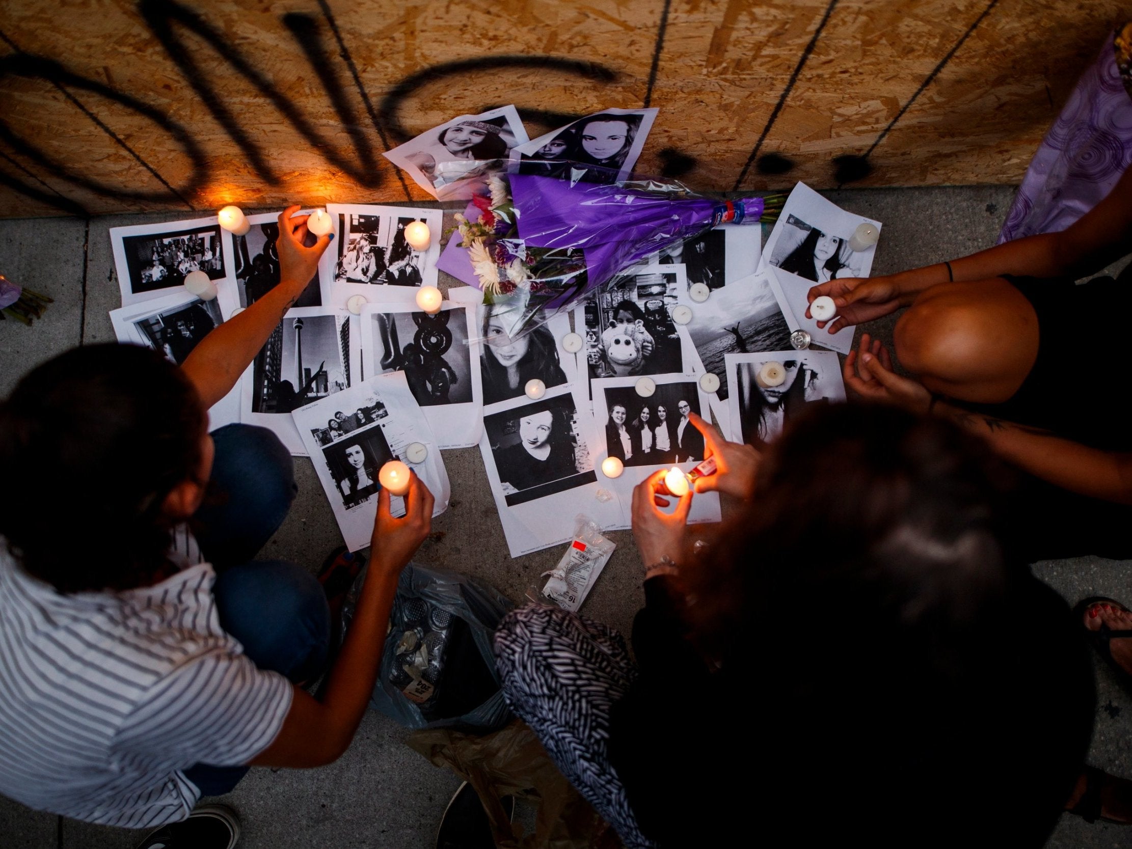 Mourners set up a vigil for one of the victims of the Toronto shooting