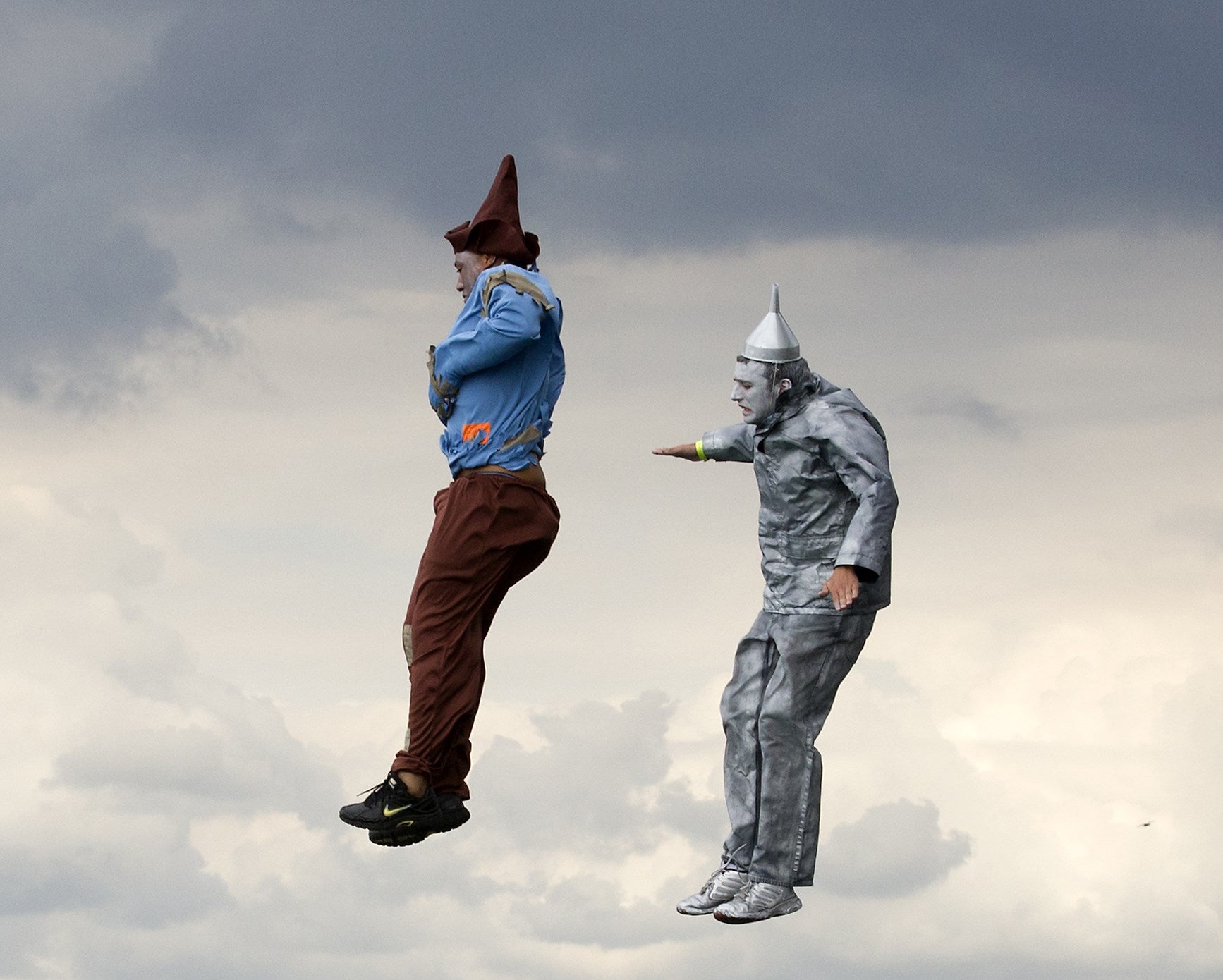 Competitors in fancy dress jump off Worthing Pier in West Sussex during the annual international birdman competition, a flight contest for human-powered flying machines