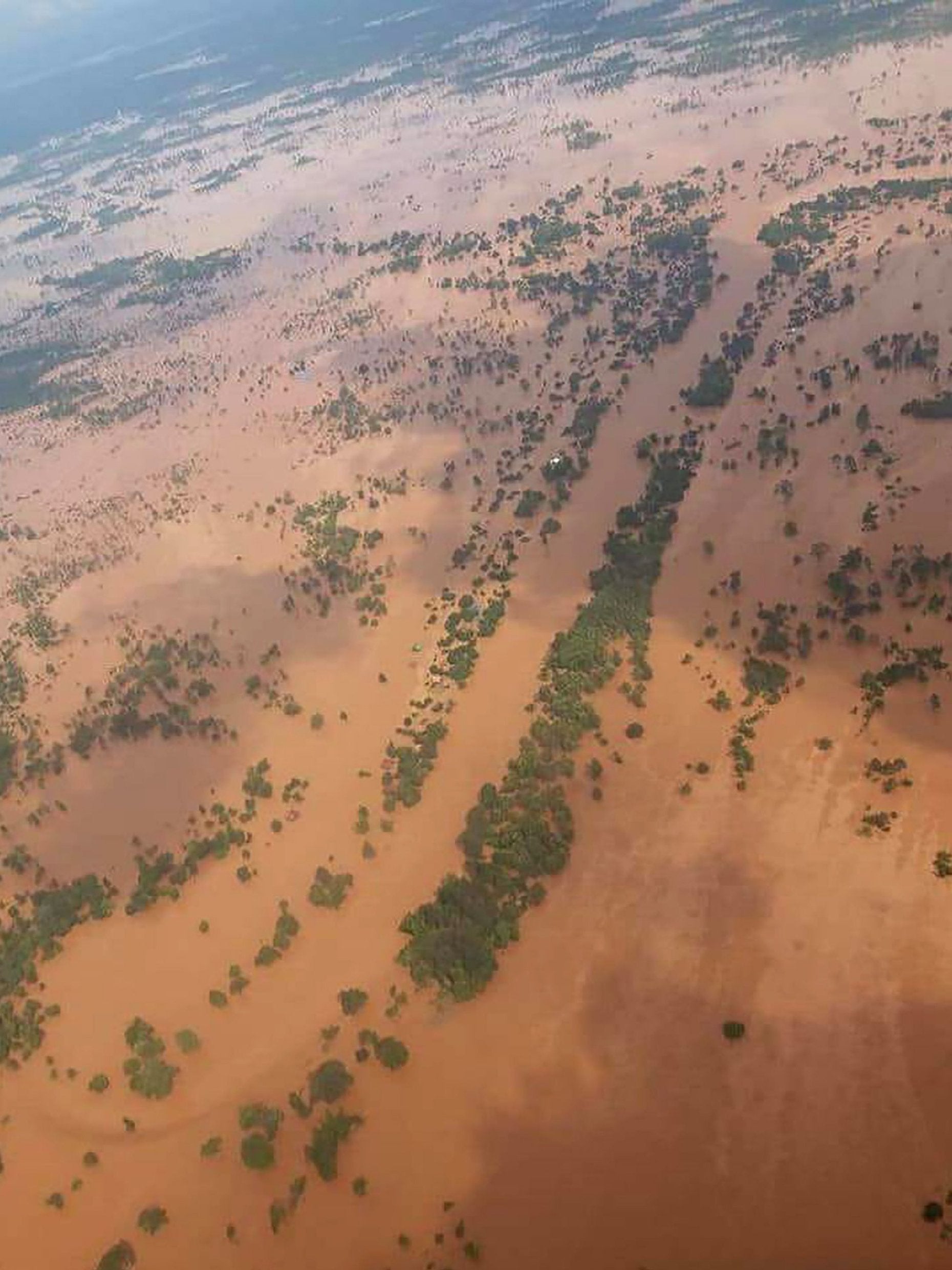 At least seven villages have been submerged by the floodwater in Attapeu province (AFP/Getty)