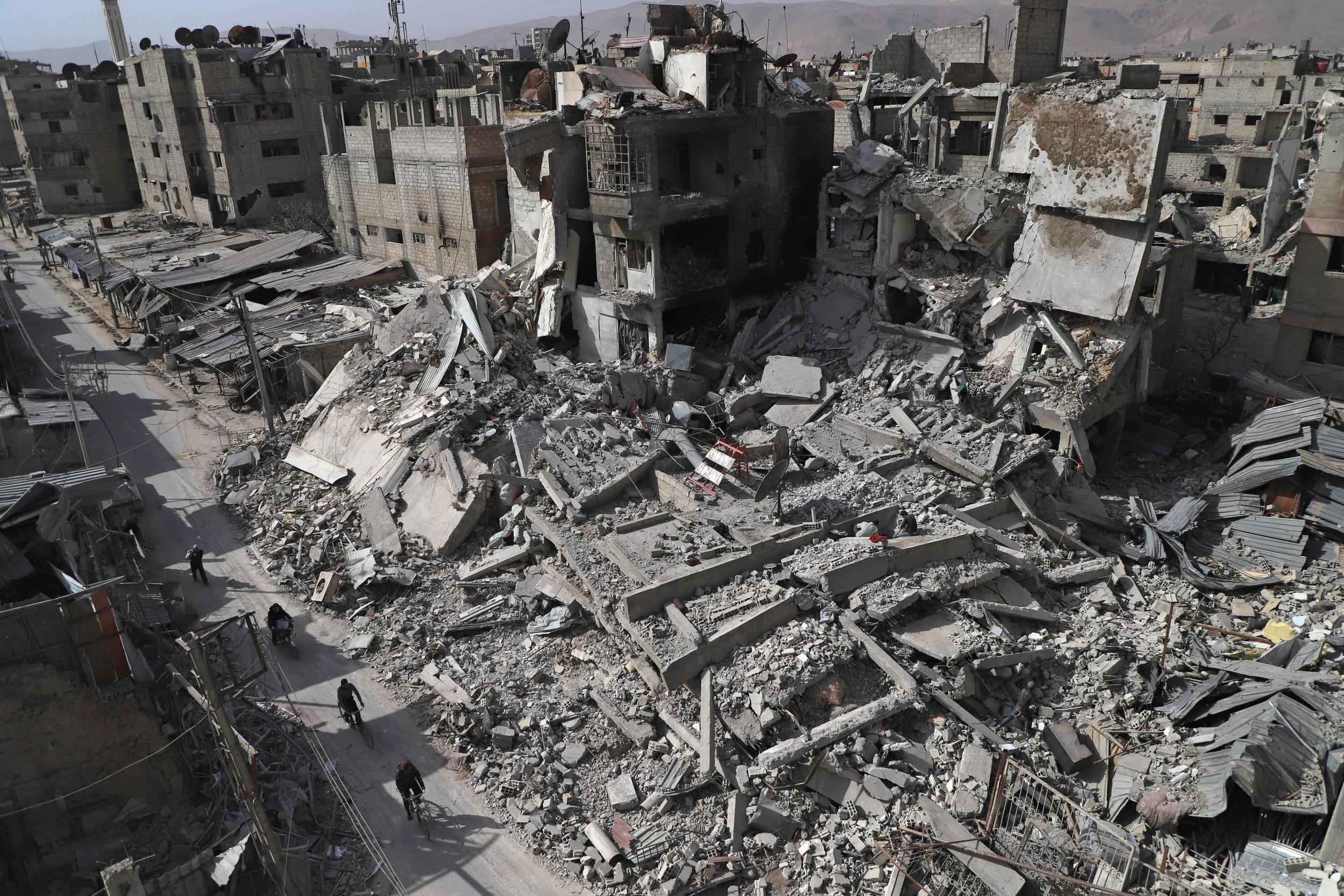 Destroyed buildings in Douma, in the rebel enclave of Eastern Ghouta on the outskirts of Damascus, photographed on 5 March 2018 during the Syrian government's campaign to retake the area