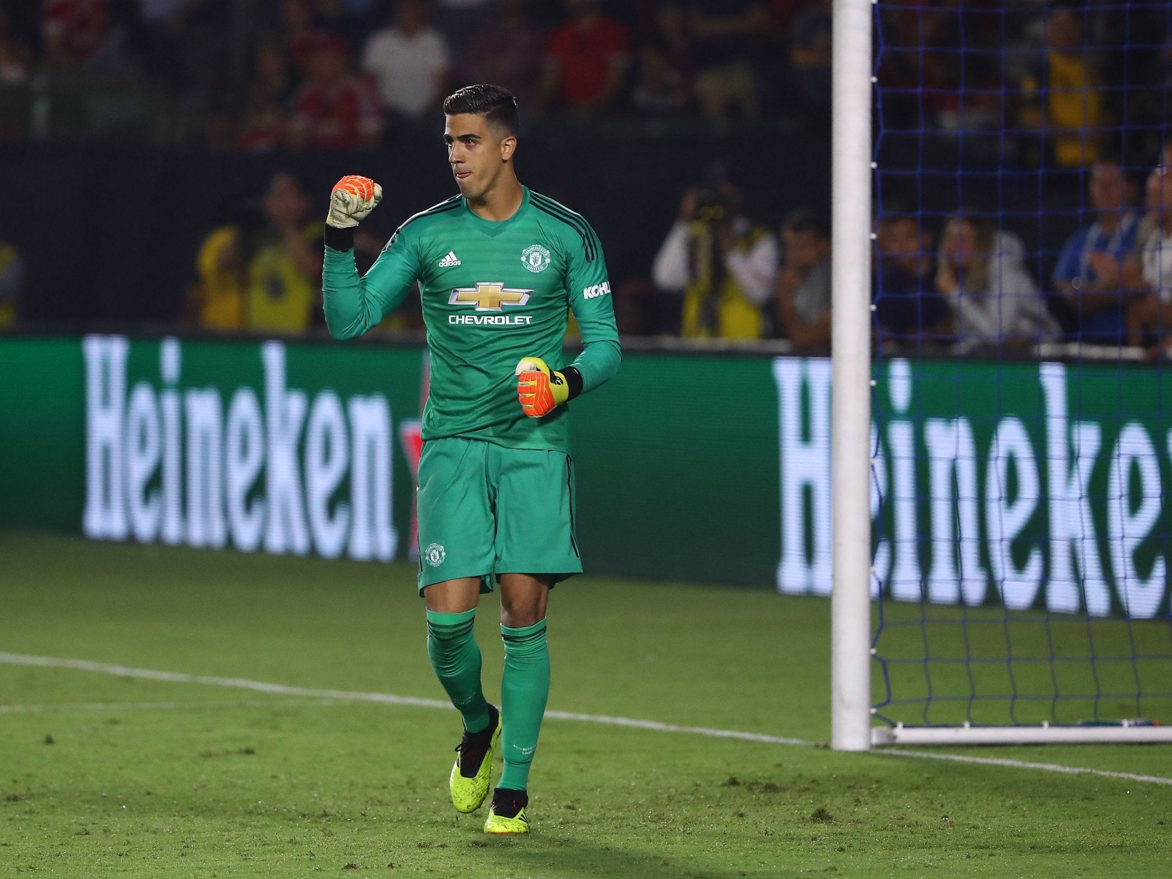 Joel Perreira celebrates Manchester United's penalty shootout victory over AC Milan