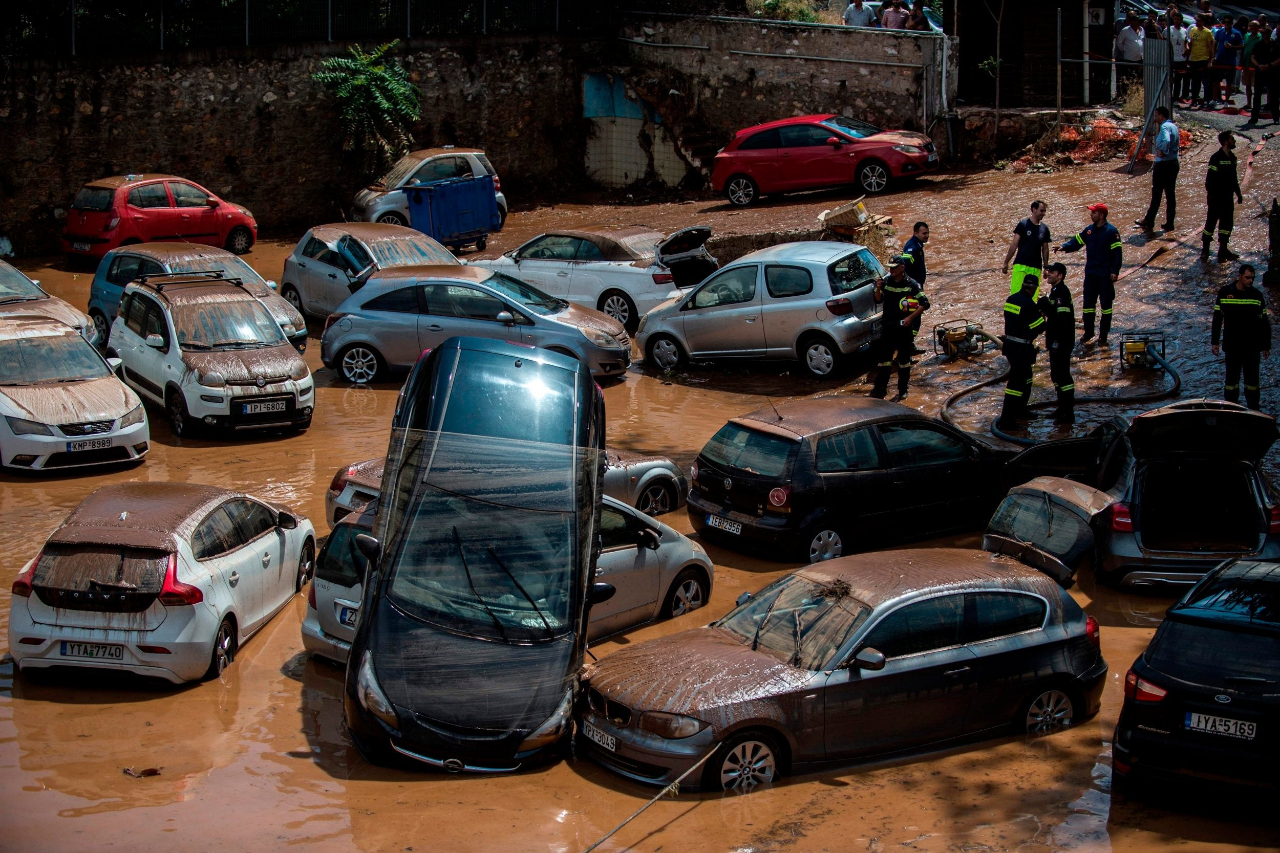 Emergency workers headed to a car park to ensure there were no people trapped, following torrential rainfall in the Greek capital