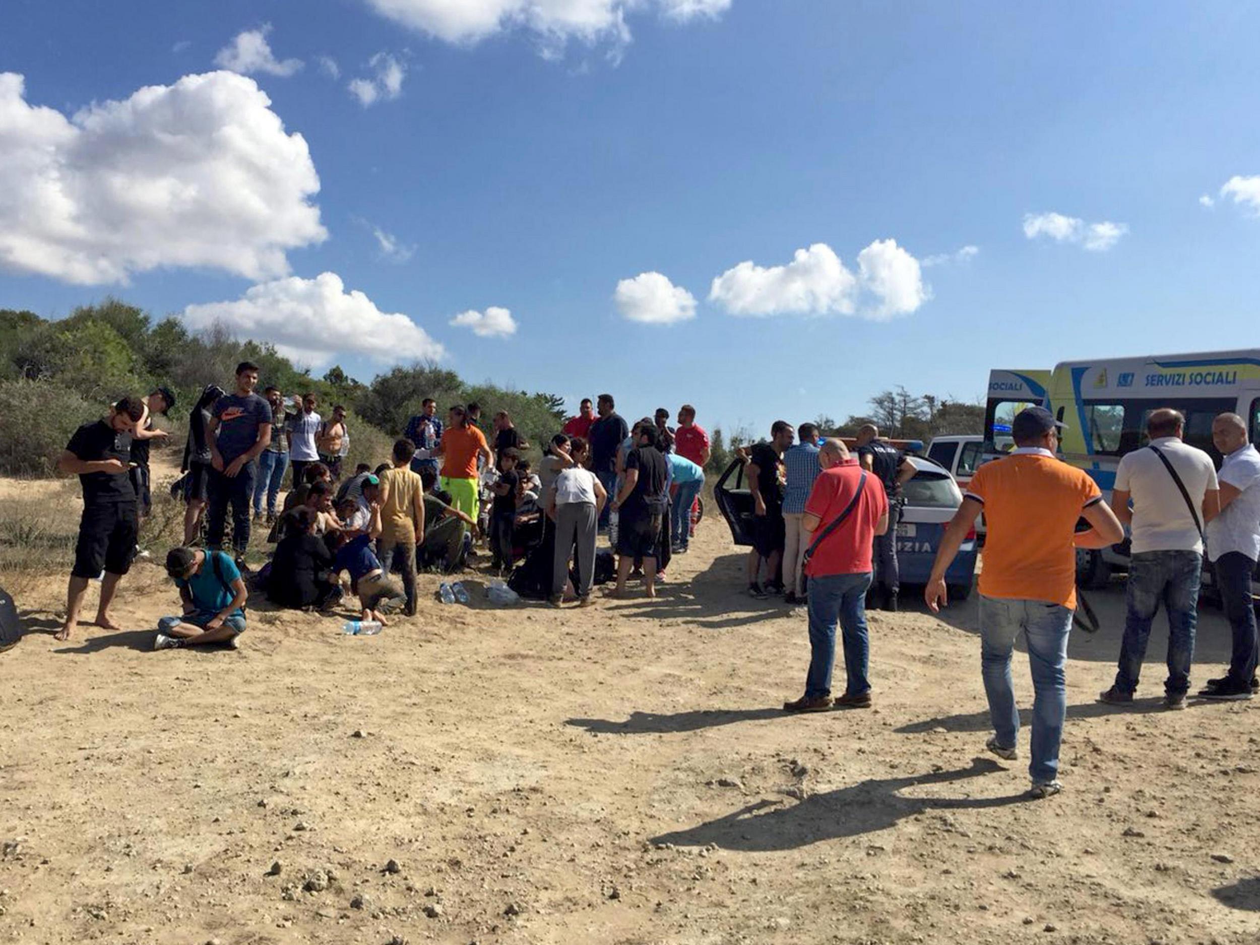 Some beach goers got into boats and helped the shipwrecked refugees to shore