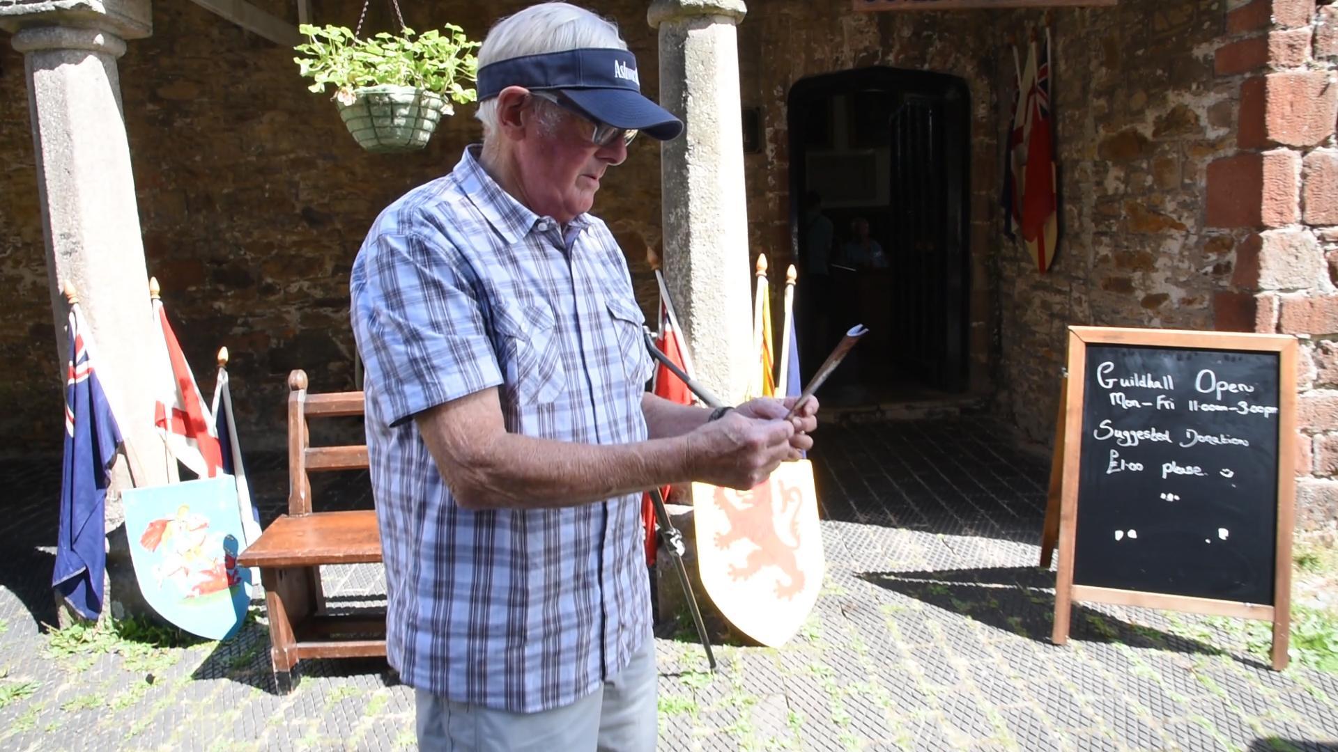 Barry Skeffington with the first passport issued by the Independent City State of Totnes