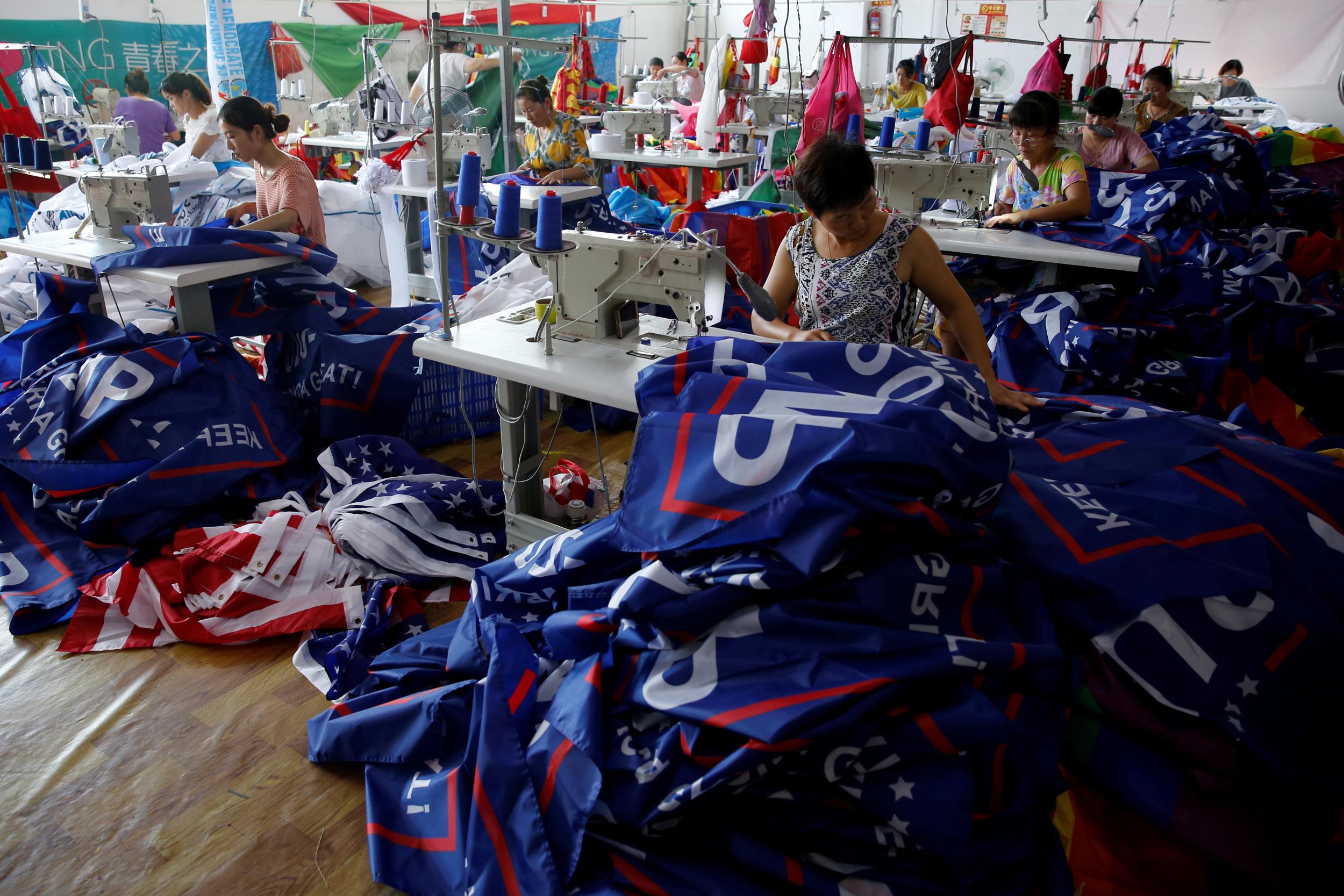 Workers make flags for U.S. President Donald Trump's "Keep America Great!" 2020 re-election campaign at Jiahao flag factory in Fuyang, Anhui province, China July 24, 2018.