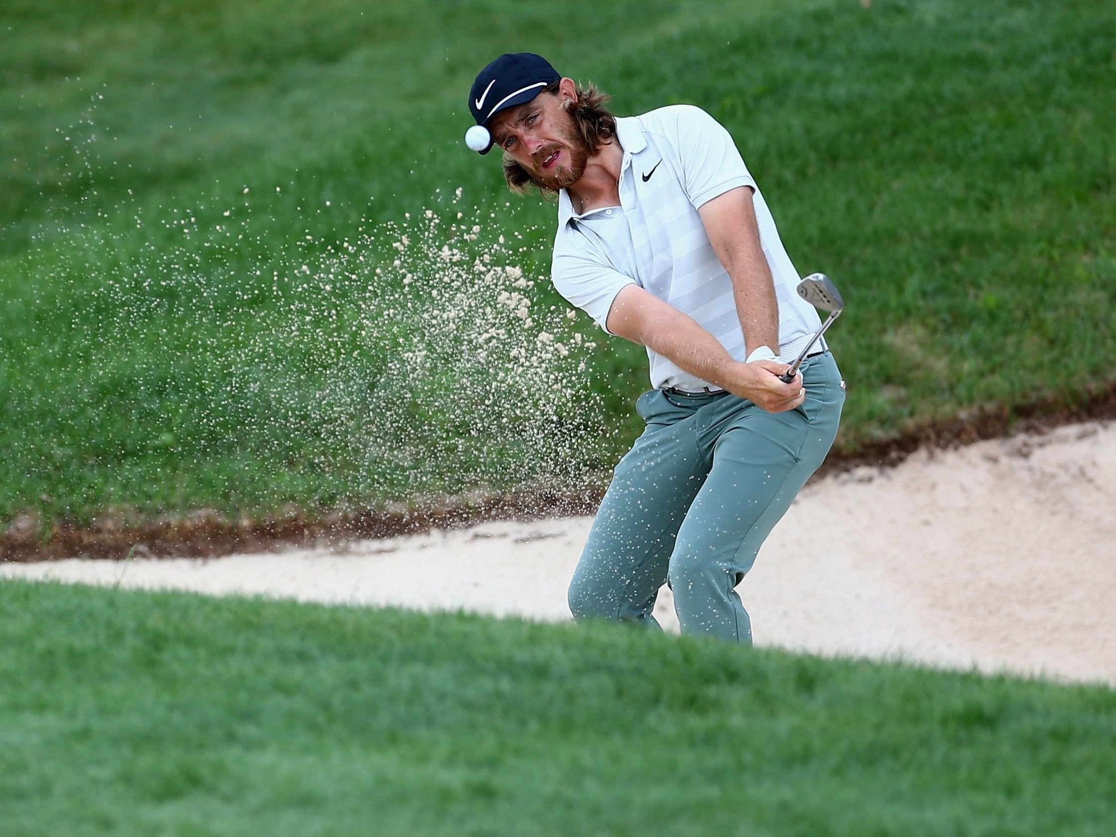 Tommy Fleetwood is four shots off the lead in a share of ninth