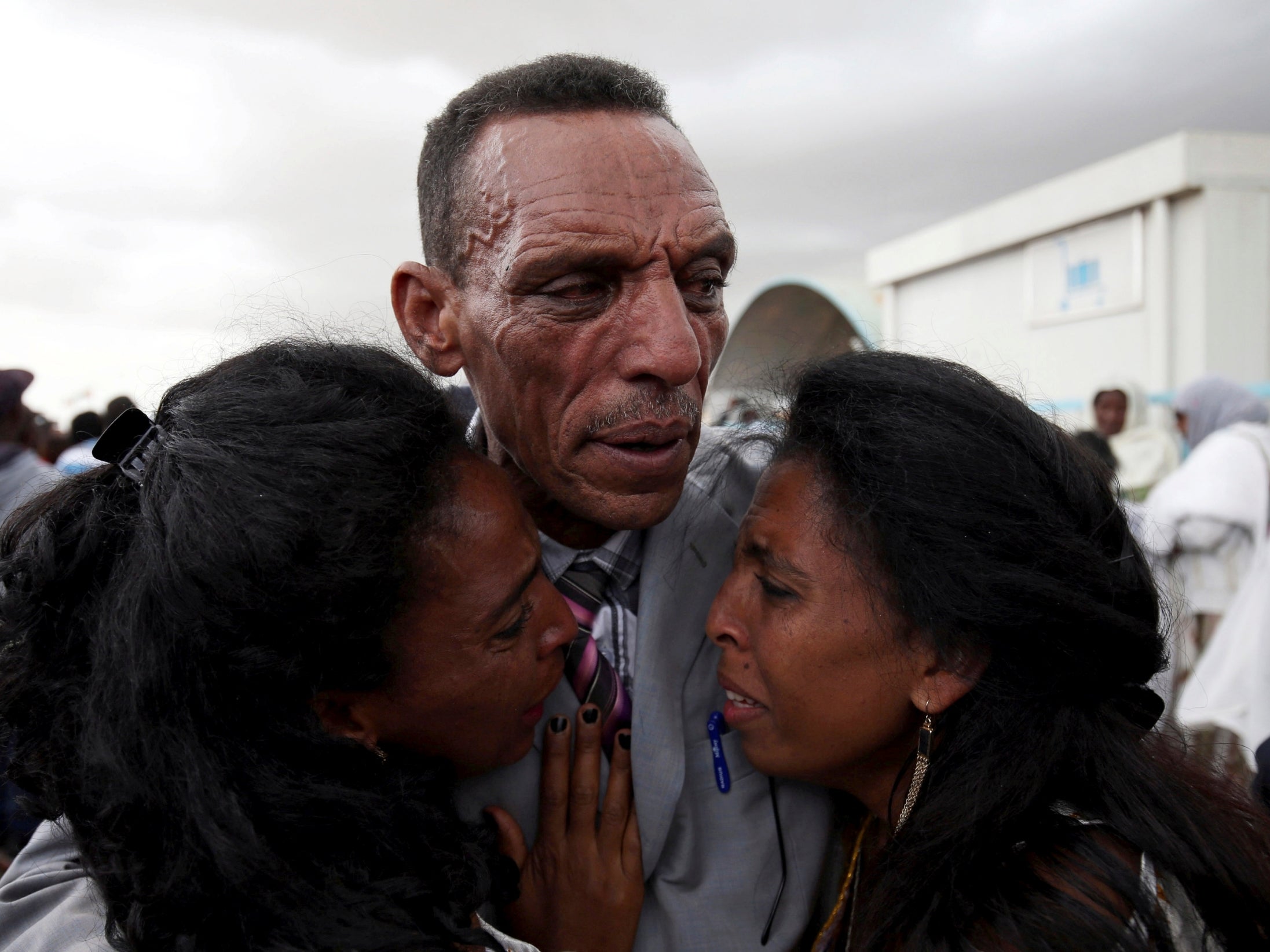 The father of two greeted his family after disembarking the first direct flight between the Horn of Africa neighbours since 1998