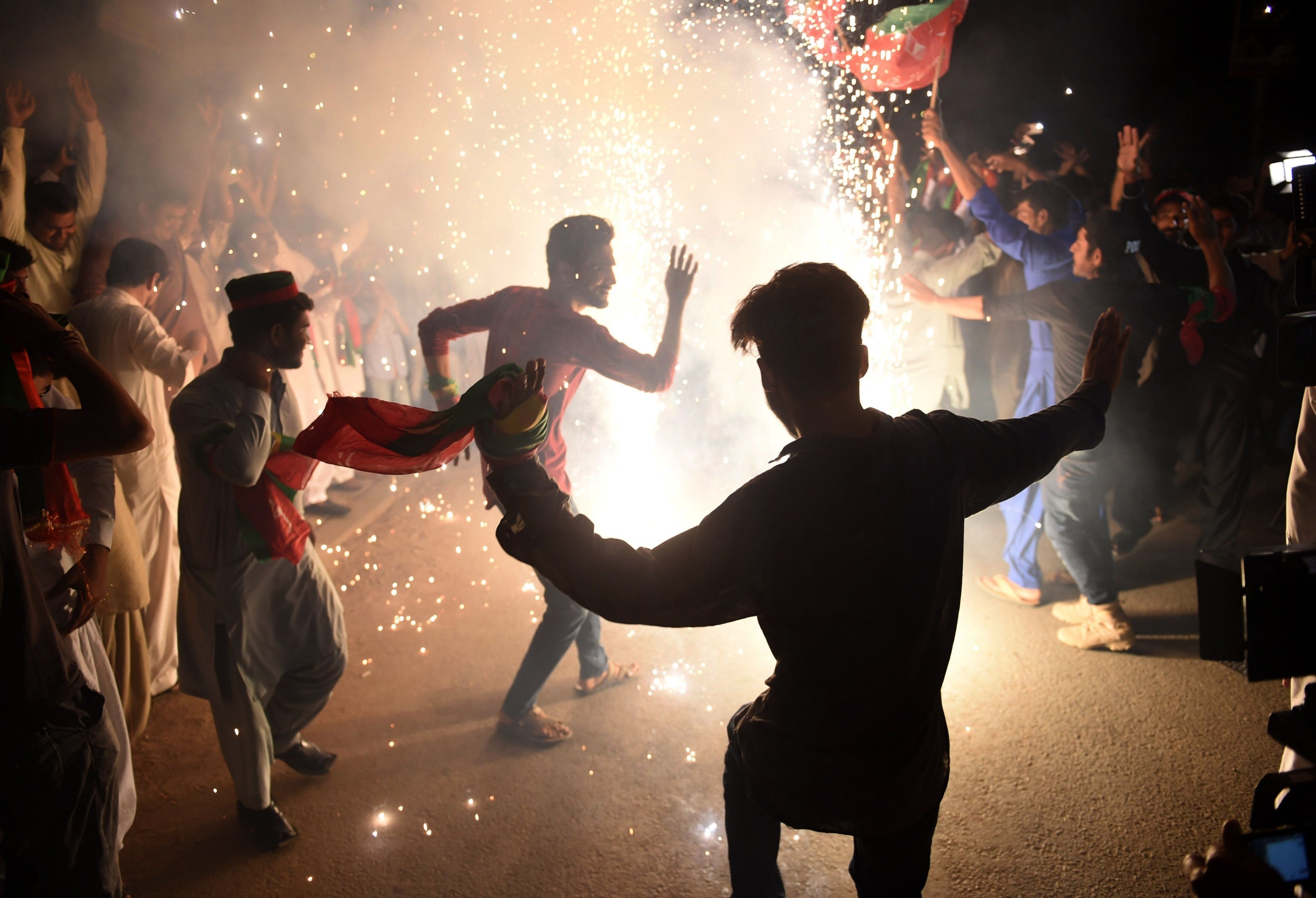 Supporters of Pakistan’s cricketer-turned-politician celebrate his election in July