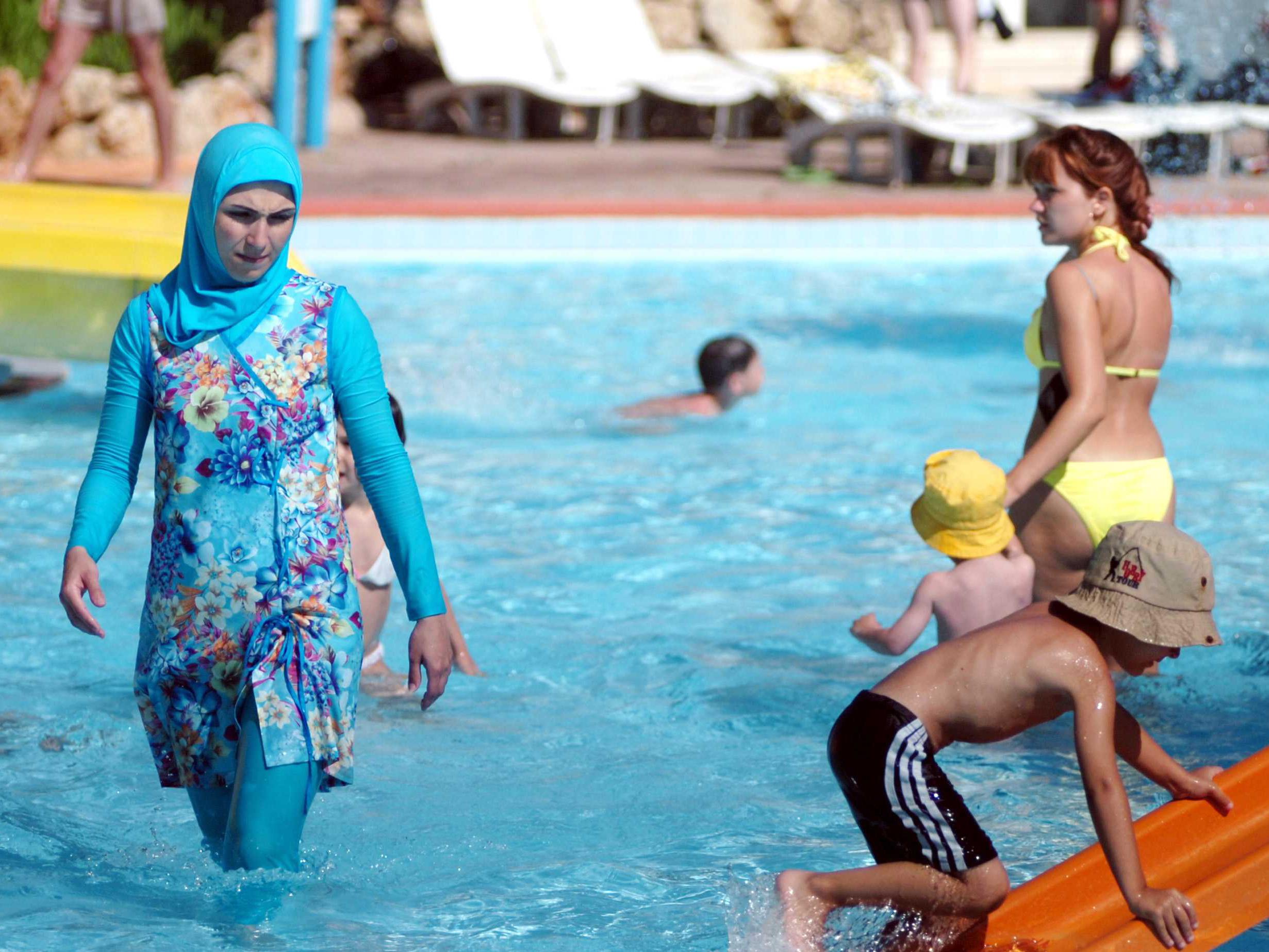 Some Muslims wear long shorts or tights, T-shirts and headscarves to go swimming