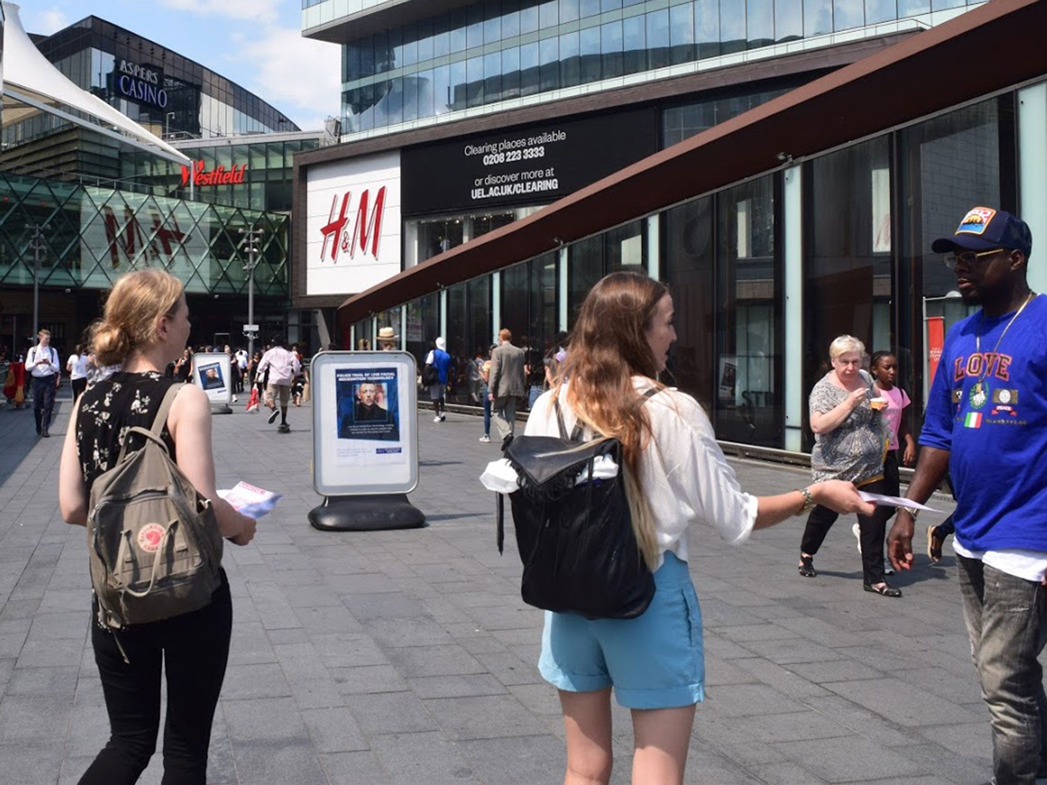 Members of Big Brother Watch hand out leaflets during a Met police trial of facial recognition in east London in July