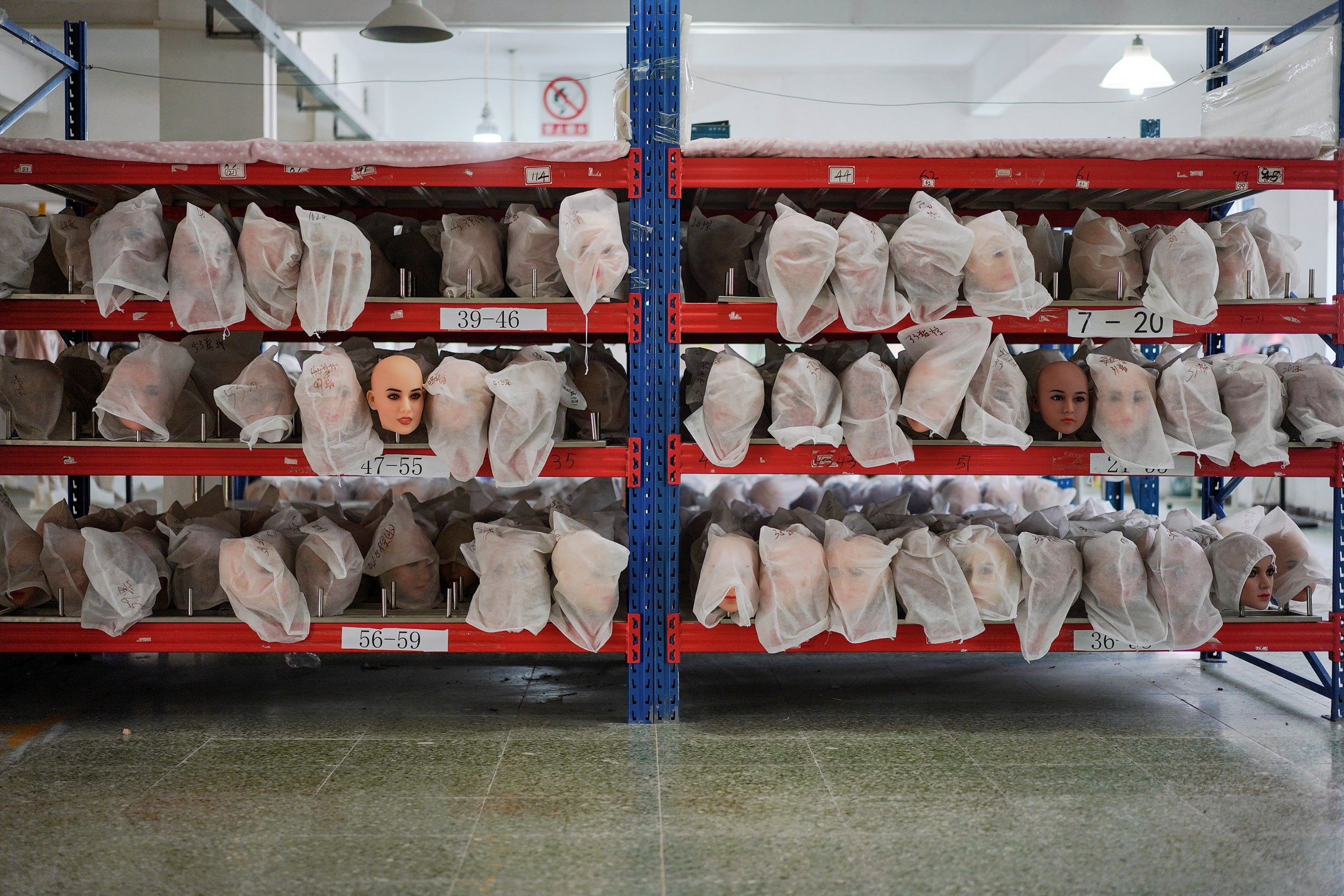 <p>File. Doll heads in dust bags are seen at a factory in Zhongshan, Guangdong, on 11 July 2018</p>