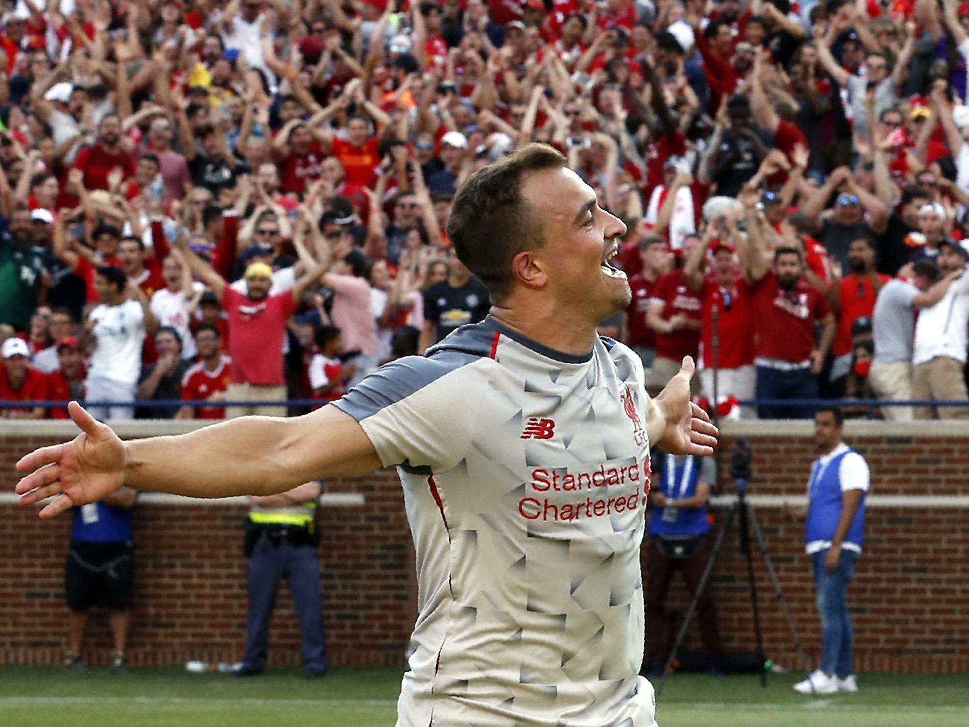 Xherdan Shaqiri celebrates his first goal for Liverpool