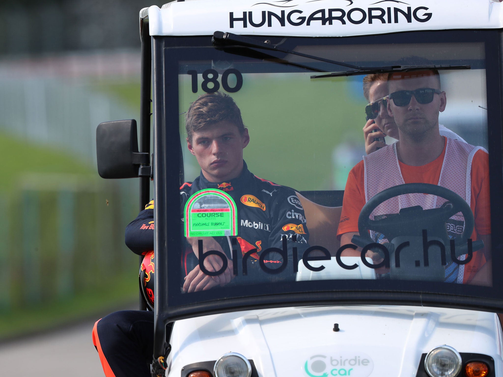 A furious Max Verstappen makes his way back to the pits after retiring