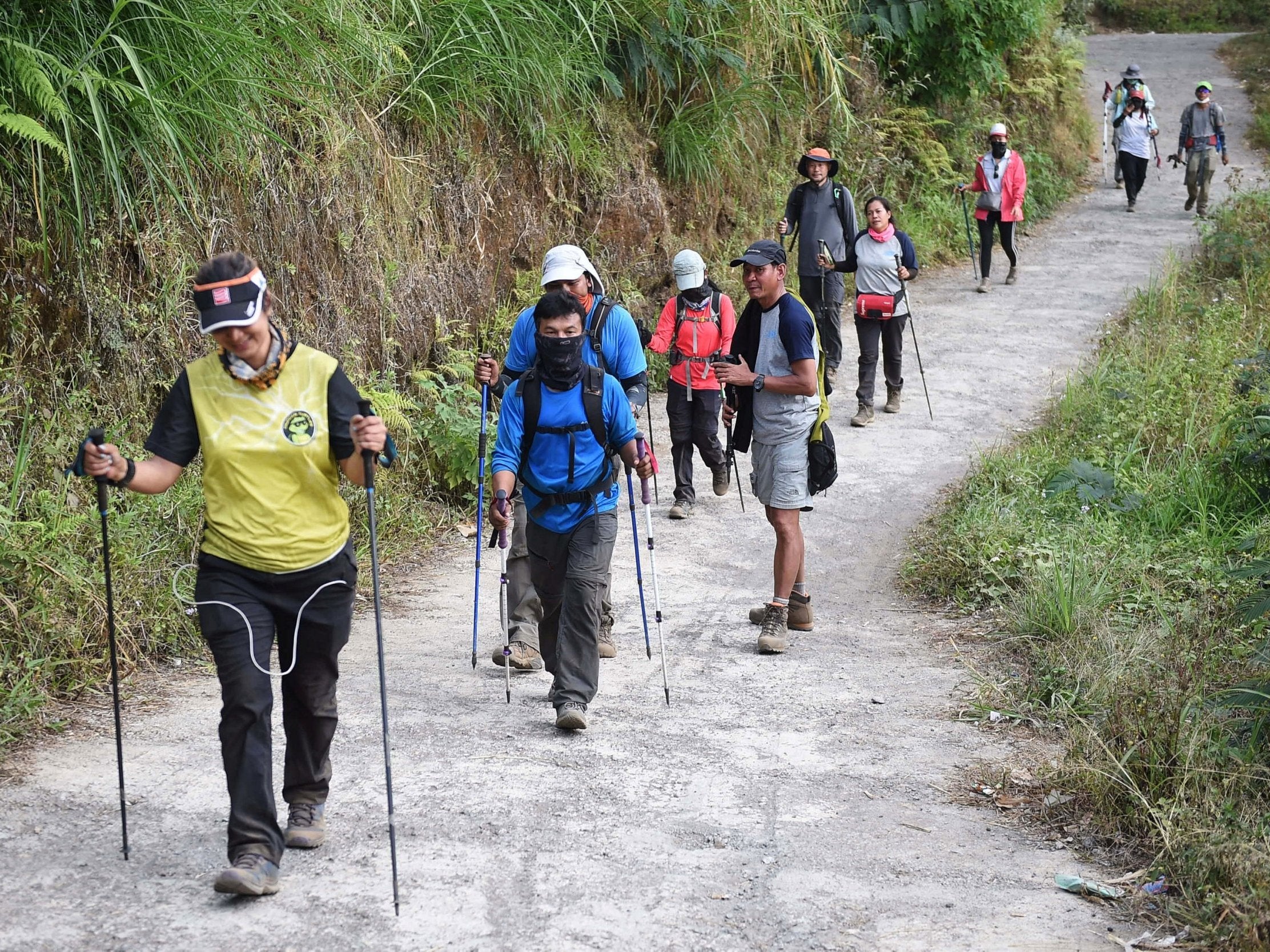 Indonesian and foreign climbers walk down from Mount Rinjani at Sembalun village in Lombok, Indonesia (Antara Foto/Akbar Nugroho Gumay/via Reuters)