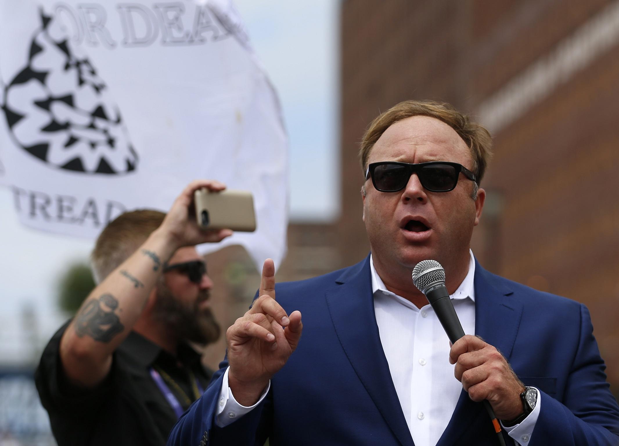 Alex Jones from Infowars.com speaks during a rally in support of Republican presidential candidate Donald Trump near the Republican National Convention in Cleveland, Ohio, U.S. July 18, 2016