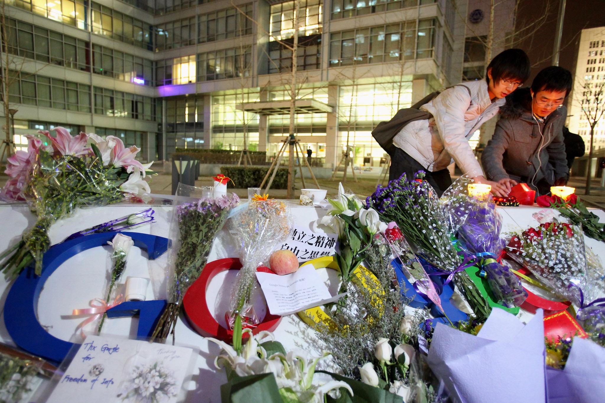 Google's fans light the candles on the Google logo at its China headquarters building on March 23, 2010 in Beijing