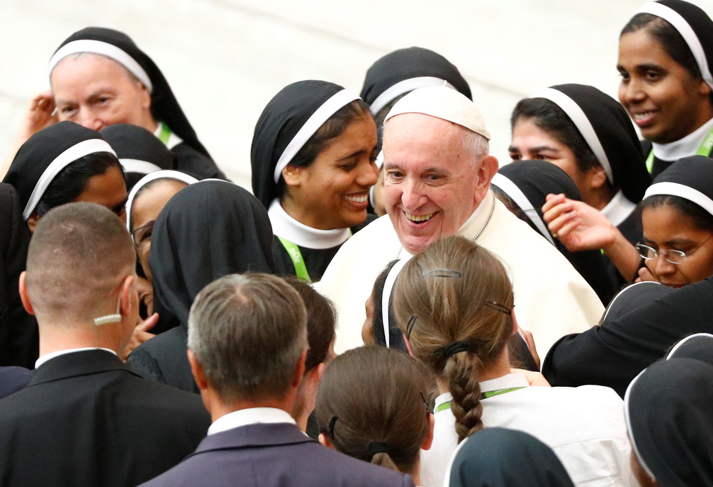 Pope Francis talks with the group of nuns after the general audience at the Paul VI Hall in Vatican, August 1, 2018.