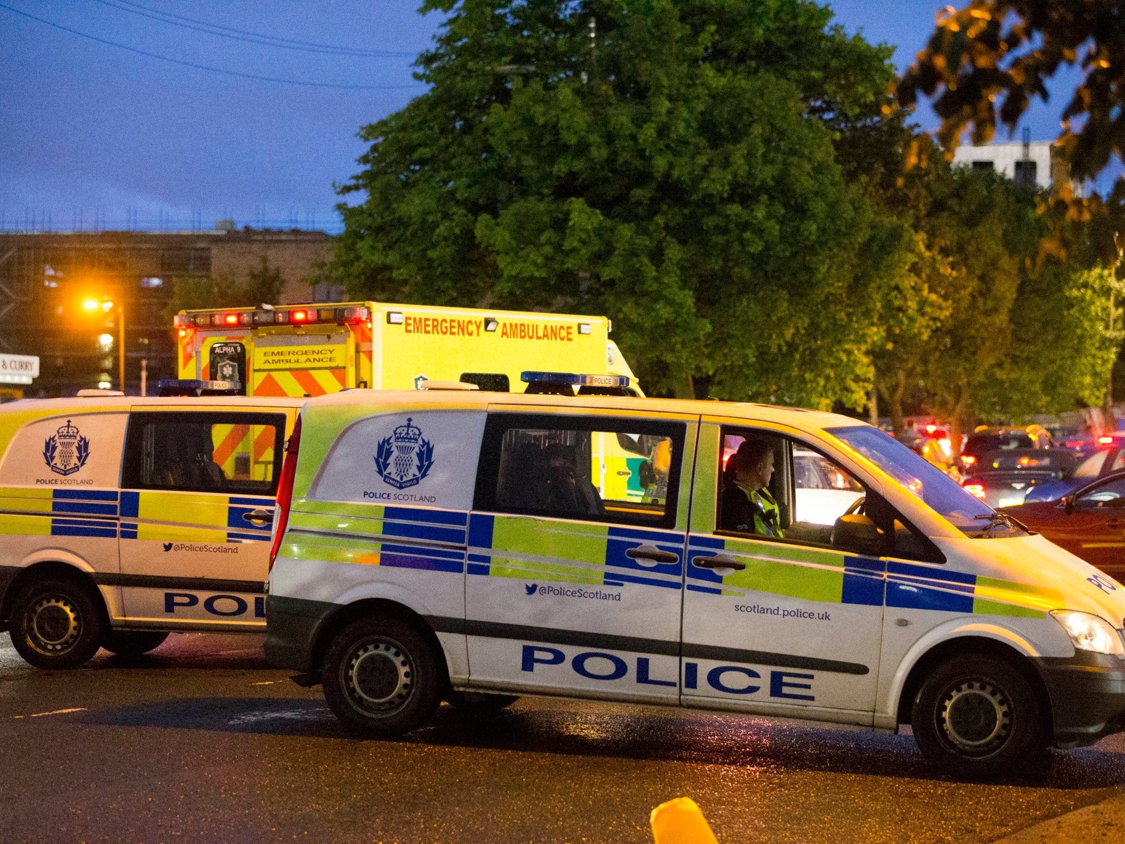 Police and paramedics outside Ibrox Stadium in Glasgow following what Police Scotland said was a 'large-scale disturbance'