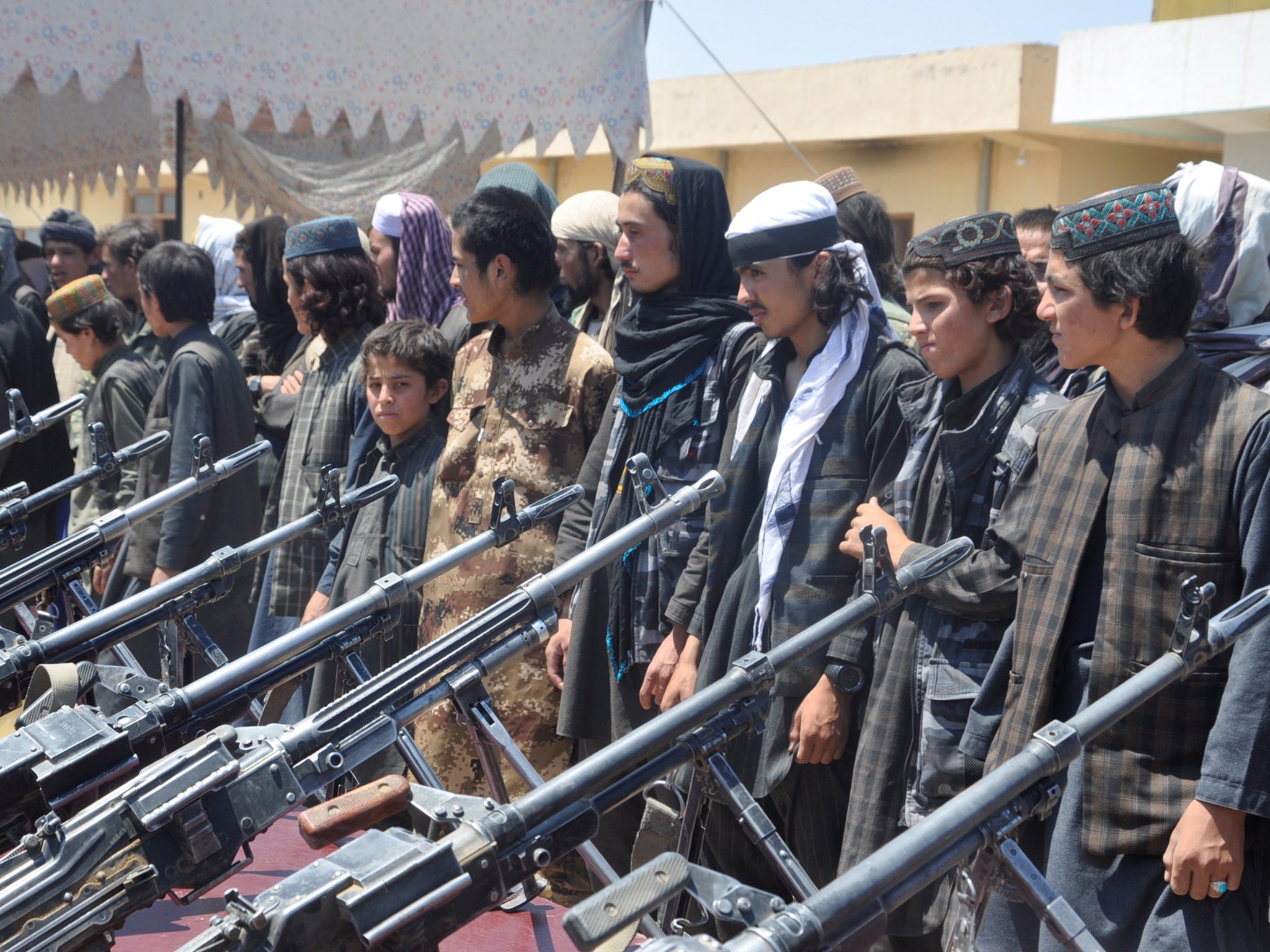 Isis fighters who surrendered to Afghan forces stand during a ceremony in Sheberghan, capital of Jawzjan province