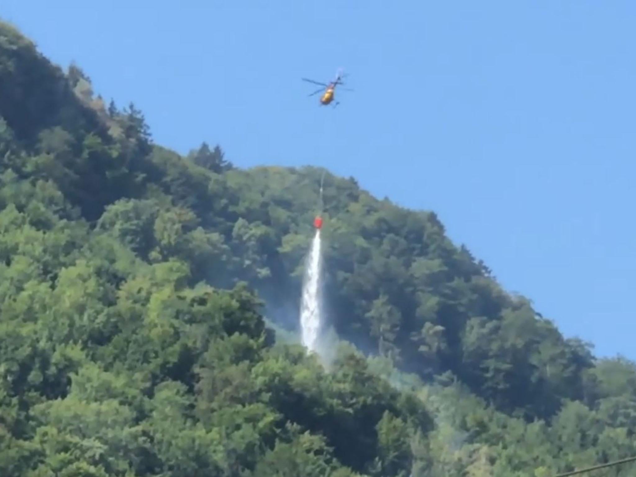 A helicopter was dispatched to douse the plane in water after it burst into flames upon impact