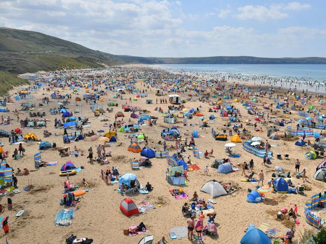 Hundreds of people took Woolacombe Beach in North Devon as the heatwave continues.